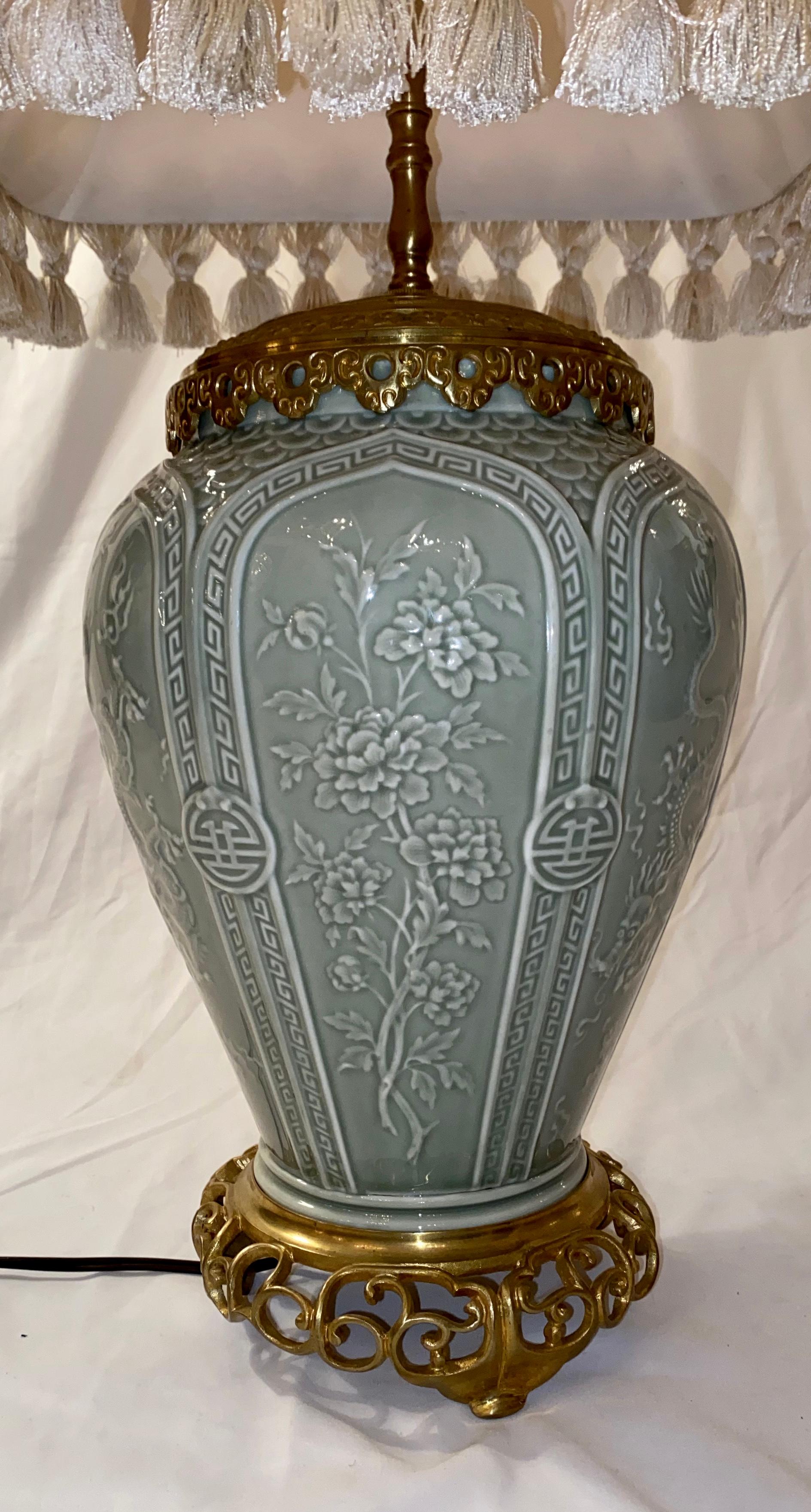 This beautiful lamp was first a vase and then mounted on bronze to serve as a lamp. The origin is Chinese, but the lamp came from England.
 