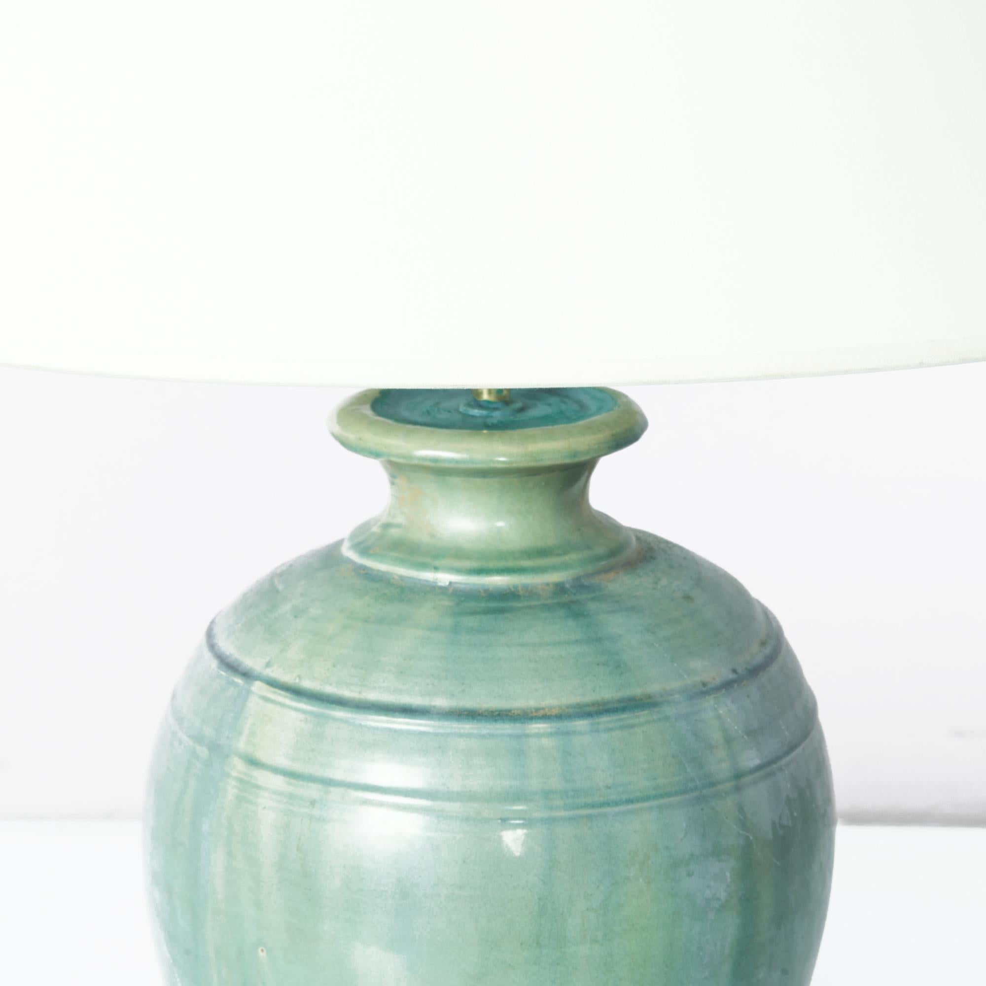 This finely crafted vintage Chinese vase has been fitted with an adjustable brass fixture and E26 lighting socket. Textured glazes, attractive colors and clean modern forms make this a great fit for neutral contemporary interiors. 26.8