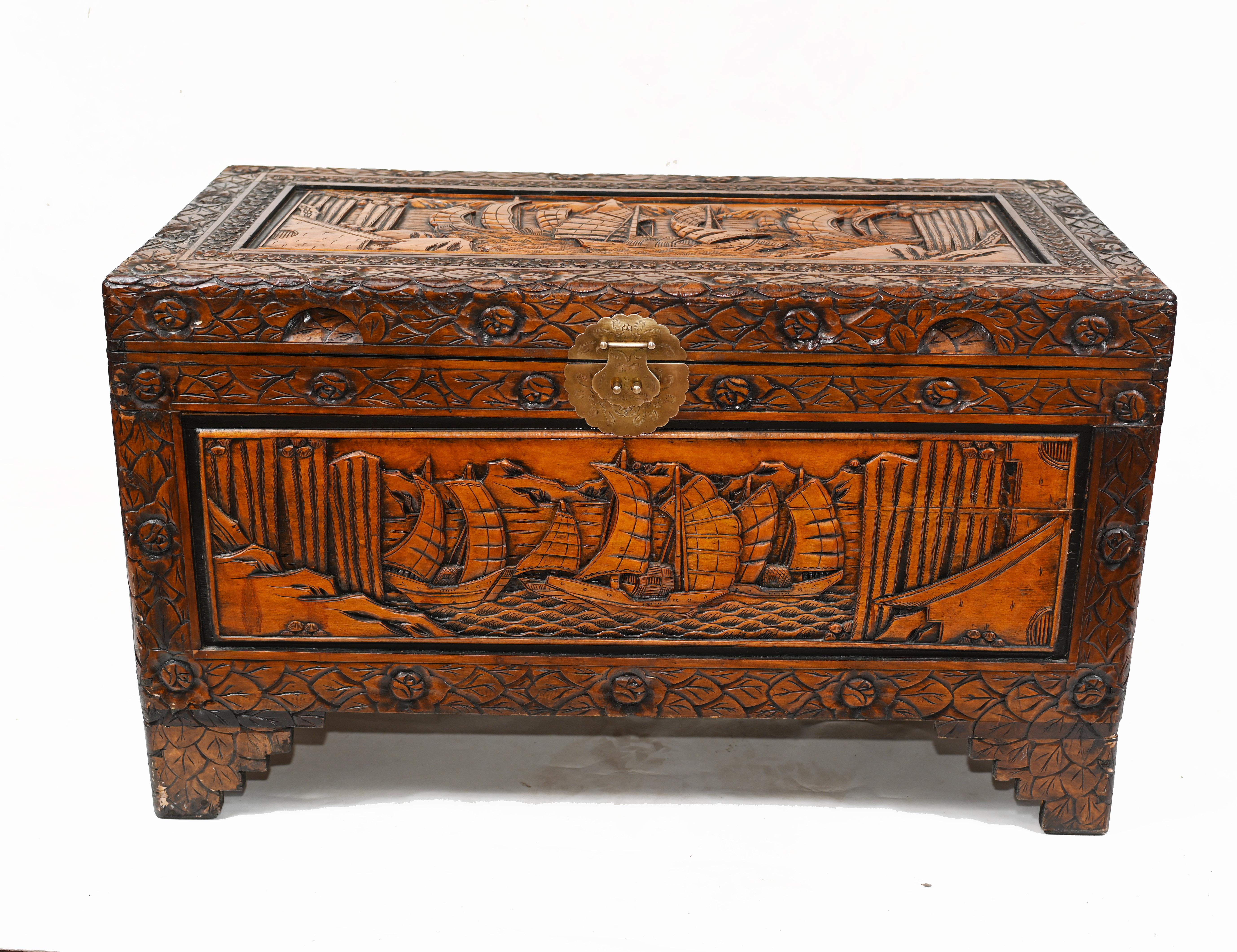 Gorgeous Chinese carved chest crafted from camphor wood
Very detailed carving showing Chinese junk sail boats
Opens out to reveal lots of storage
Great interiors piece and highly collectable
Can also function as a coffee table
Most of these Chinese