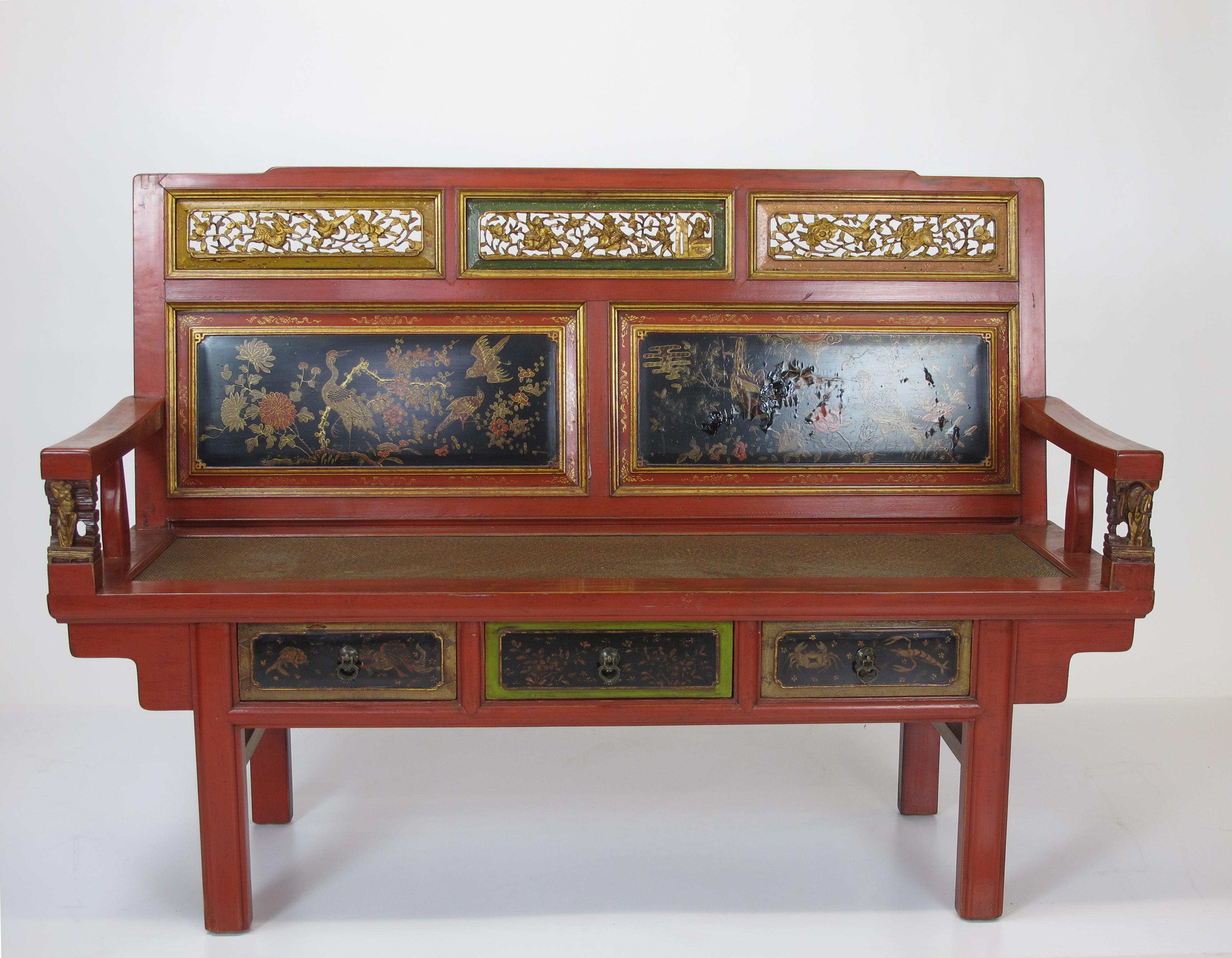 The red frame highlights beautiful gilded hand painted and carved back. It has 3 drawers under the seat with gilded painting and 2 small carved in front the armrest. This antique Southern style antique bench makes an adorable addition in any room.