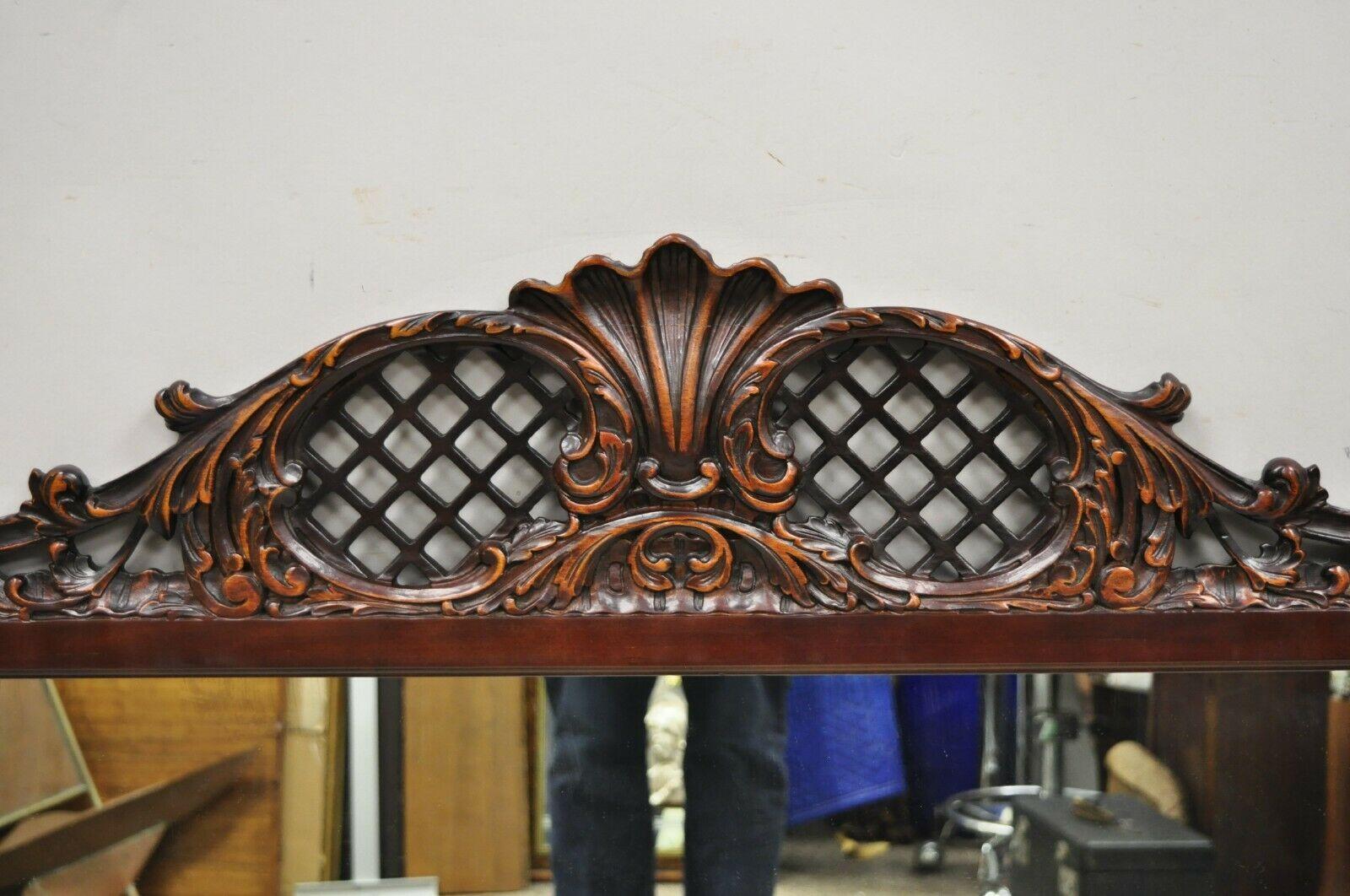Antique Chinse Chippendale Style Fretwork carved mahogany wall mirror. Item solid wood frame, beautiful wood grain, nicely carved details, very nice antique item, quality American craftsmanship, great style and form. Circa Early to Mid 20th Century.