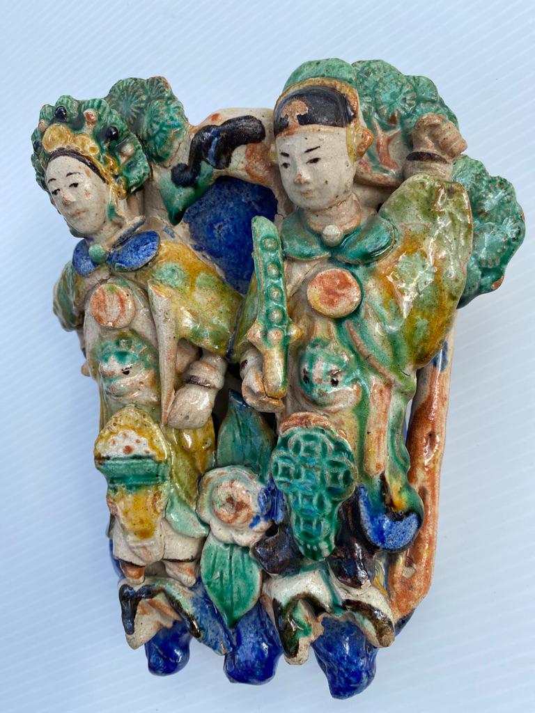 This antique Chinese chopstick holder represents a married couple of their wedding day.
Dress in traditional costumes very colorful highly collectable having flowers and tree to the background.