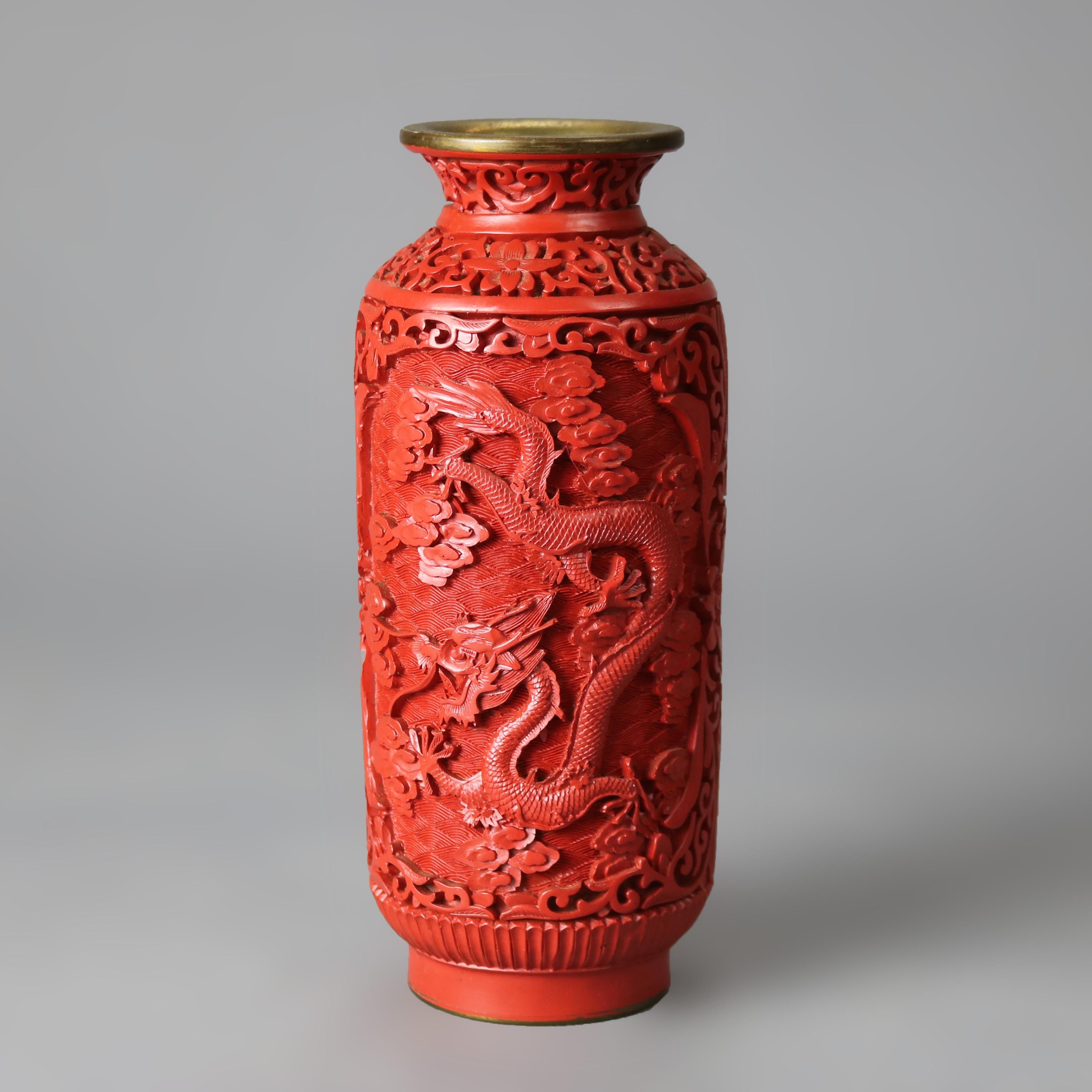 An antique Chinese Cinnabar vase offers dragon and foliate decoration, c1920

Measures - 8