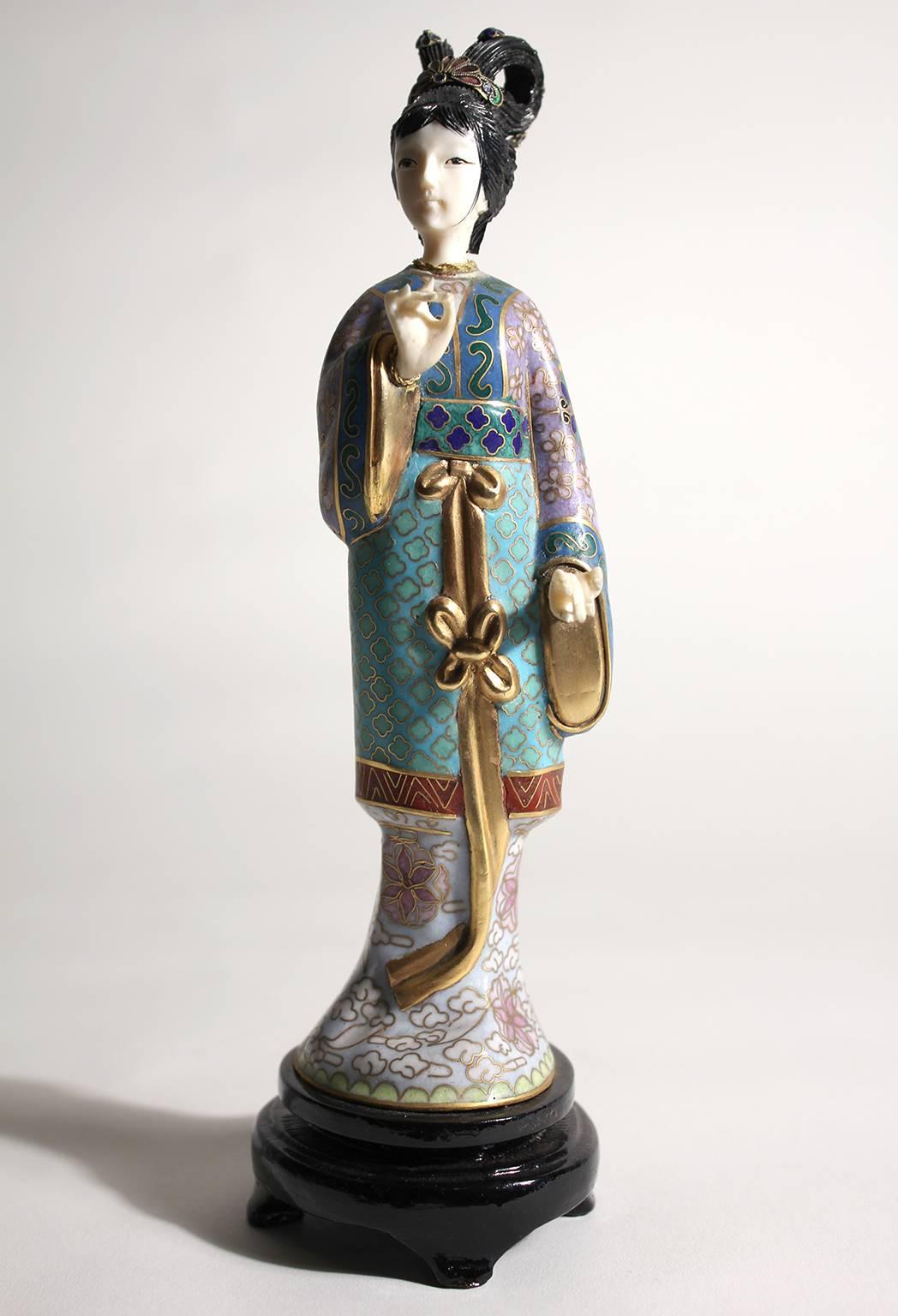 Stunning Chinese Guanyin cloisonné enameled figurine/sculpture. Comes with the original wood stand. Hands and head are carved. Stunning color and details are second to none. Measures 8 1/2