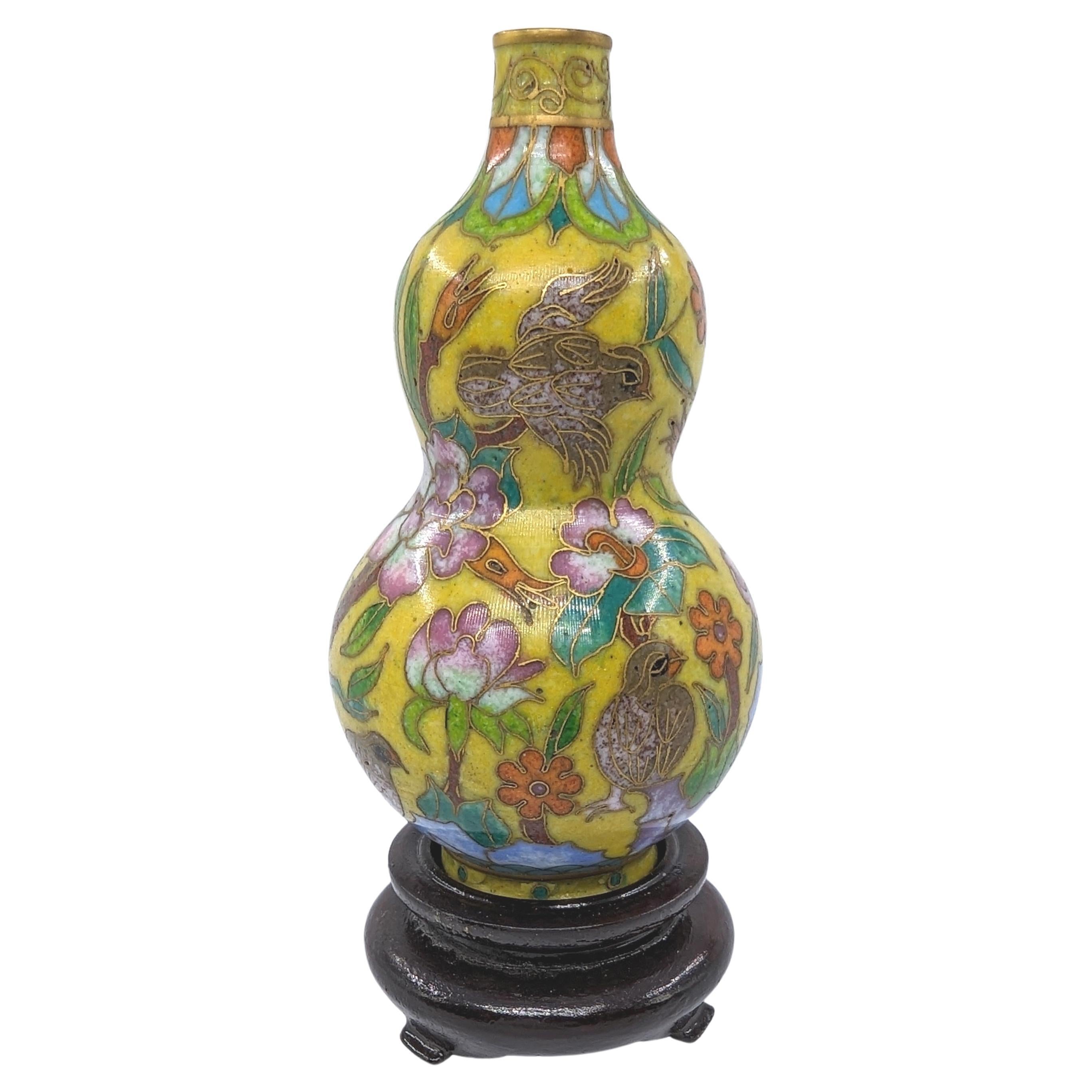 Fine antique Chinese cloisonne snuff bottle or miniature vase in hulu double gourd bottle form, on a carved hardwood stand

Early 20c Republic Period
