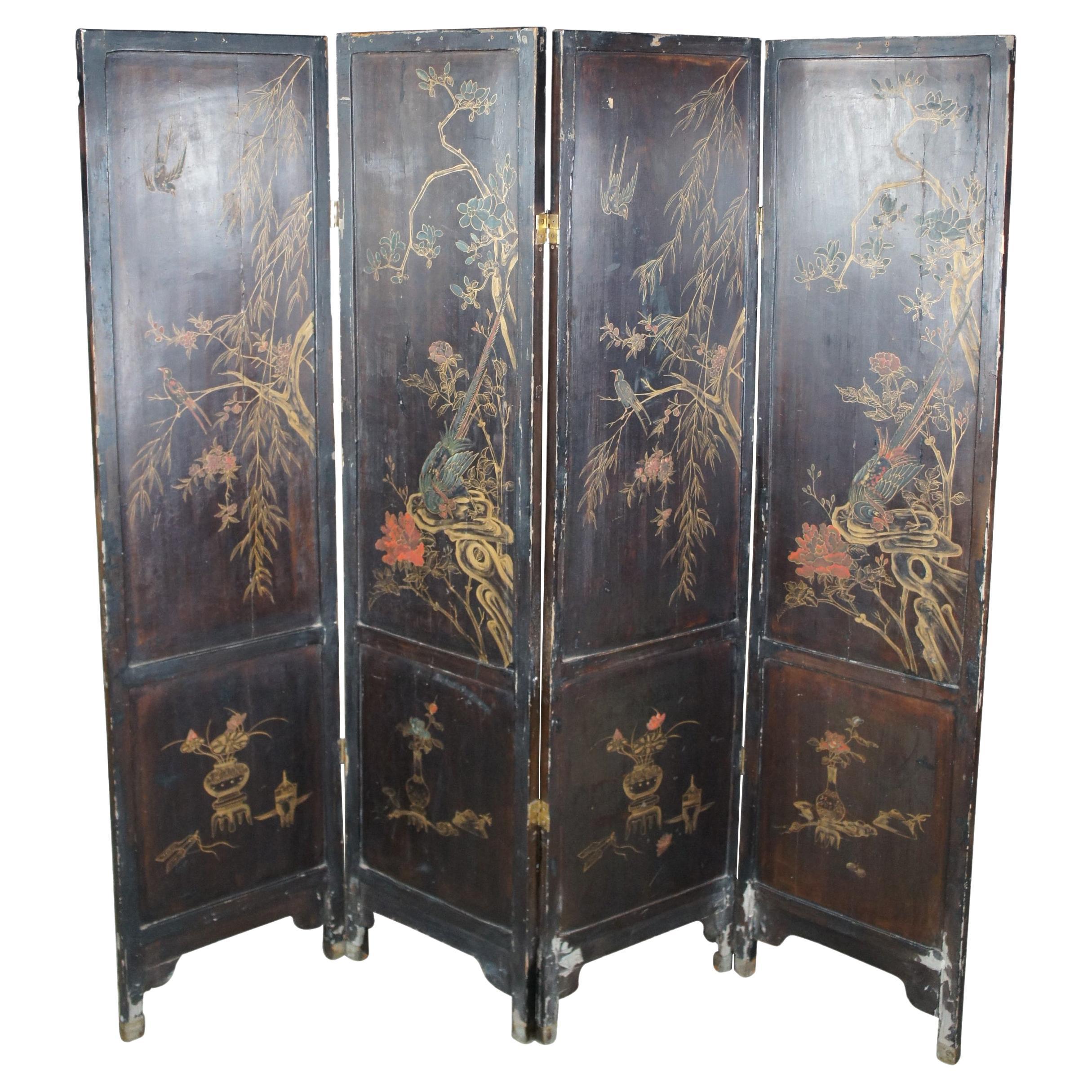 A beautiful early 20th century Chinese Coromandel 4 panel black lacquer room divider. One side Features a Chinese village and river landscape with applied and carved bovine over a gold painted backing.  A pagoda or temple is at the fore front with