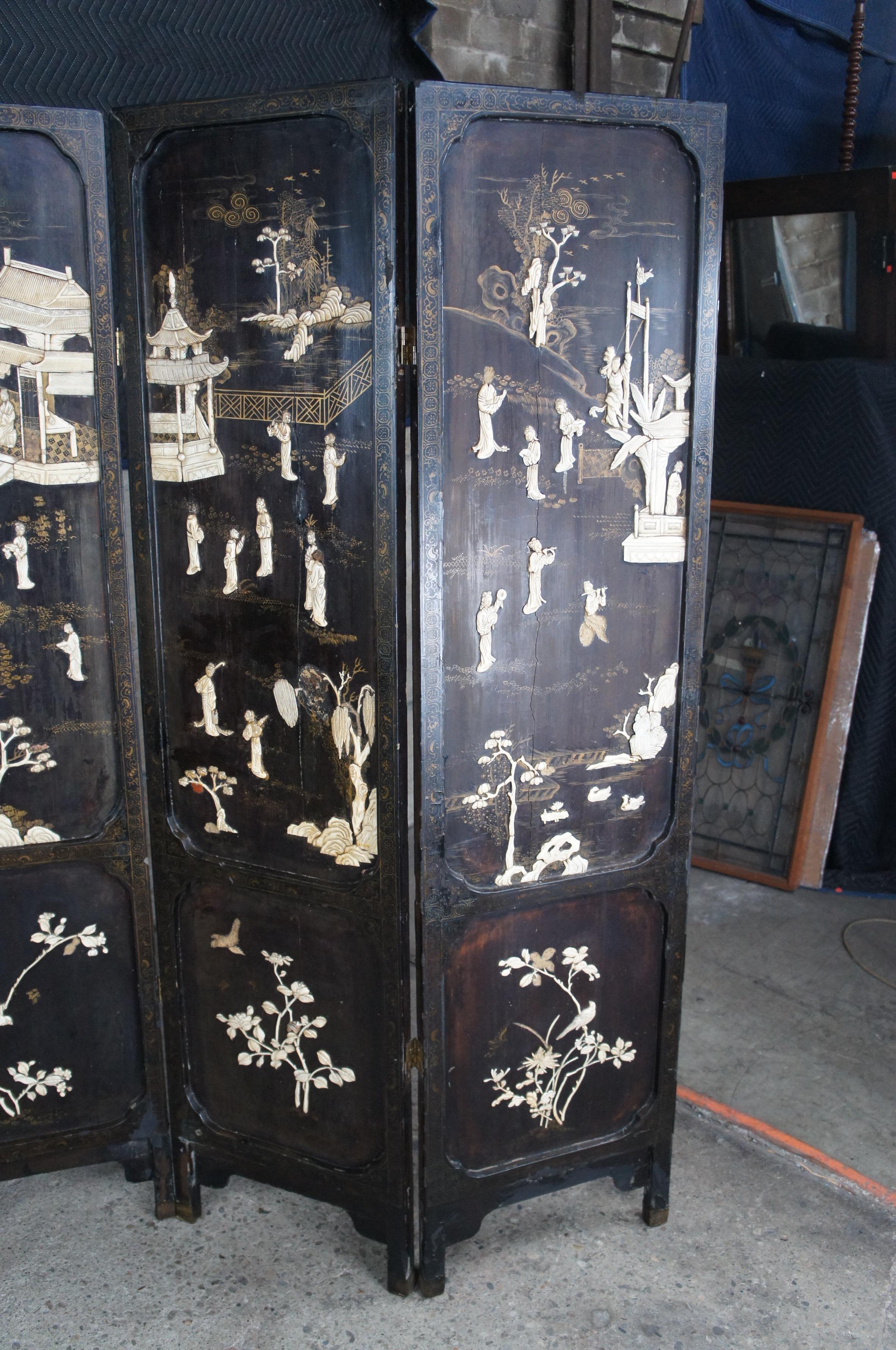 Os Écran pliant chinois ancien en laque noire ivoire peinte et sculptée de Coromandel en vente
