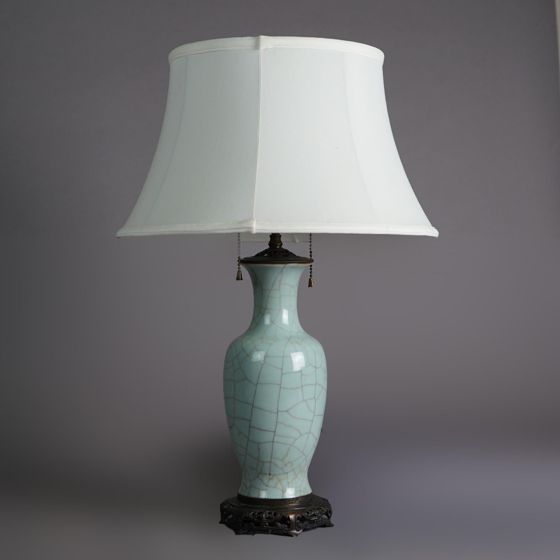 An antique table lamp offers Chinese art pottery vase with crackled celedon glazing, c1930

Measures - 23