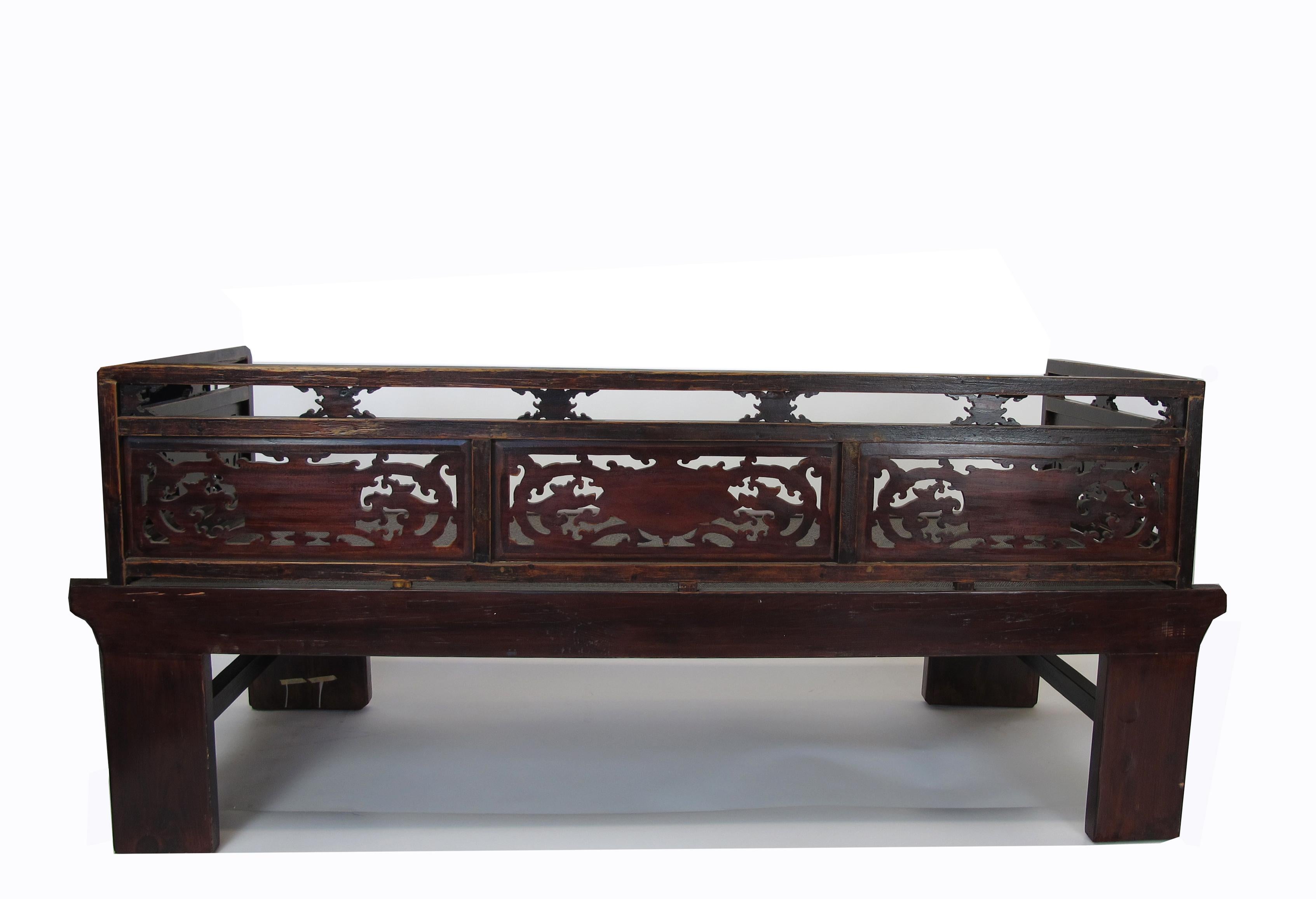 Early 20th Century Antique Chinese Daybed with Hand Carved Railing