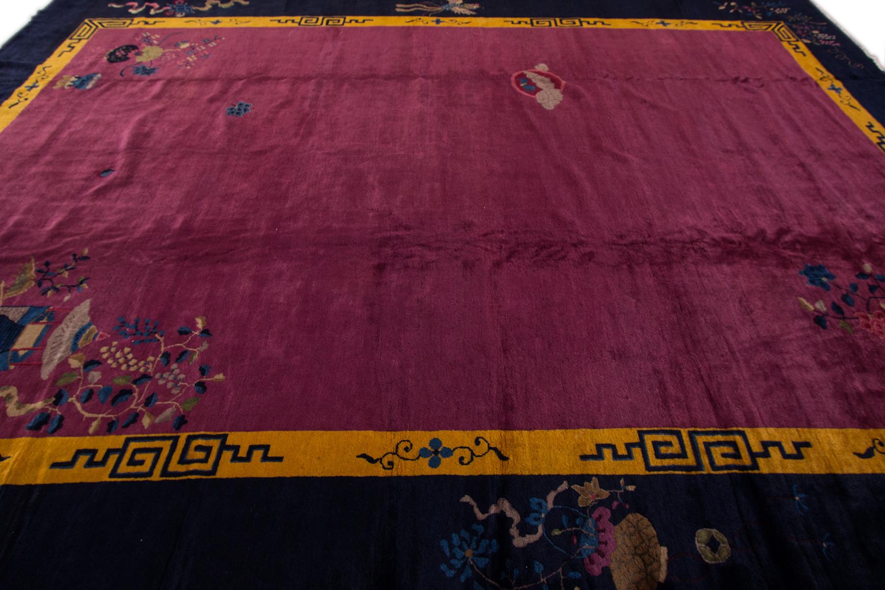 Beautiful Antique Chinese Deco Rug, hand-knotted wool with a purple field, dark blue frame in an allover classic Chinese design.
Circa 1920.

This rug measures 11' 3