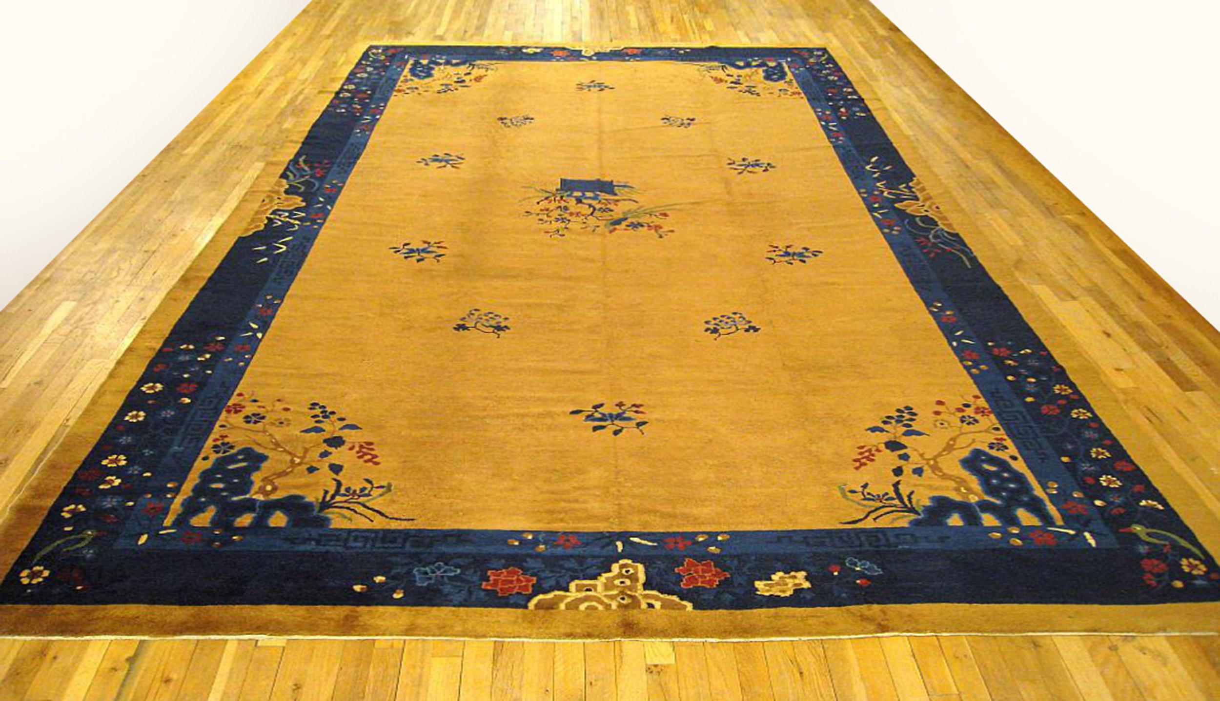 Antique Chinese Peking rug, large size, circa 1910.

A one-of-a-kind antique Chinese Peking oriental carpet, hand-knotted with medium thickness wool pile. This beautiful rug features chinese motifs on a camel central field, with a blue outer