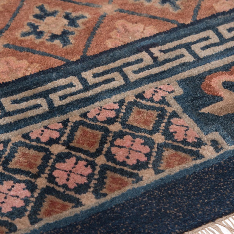 Taking months or even years to create, this gorgeous carpet was painstakingly crafted by tying pieces of vegetable-dyed wool around a cotton warp in thousands upon thousands of individual knots. A true labor of love, the resulting carpet is marked