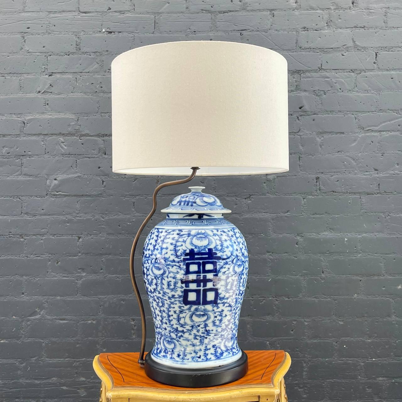 Antique Chinese Double Happiness Jar Porcelain Table Lamp 

Country: China
Materials: Carved Wood, Porcelain, Linen Shade
Condition: Newly Linen Shade, One Minor Chip
Style: Chinese Antique
Year: 1960s

$1,400

Dimensions 
29”H x 10”W x