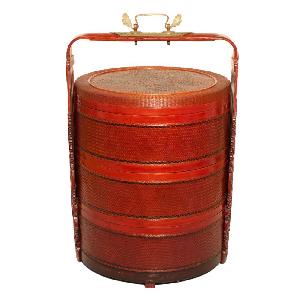 Antique Chinese Dragon Wedding Basket, bamboo, rattan, wood and brass, 19th century. 
A 3-tier round form with magnificently carved bamboo overhead handle and engraved brass hardware. The woven containers of equal height with the bottom tier affixed