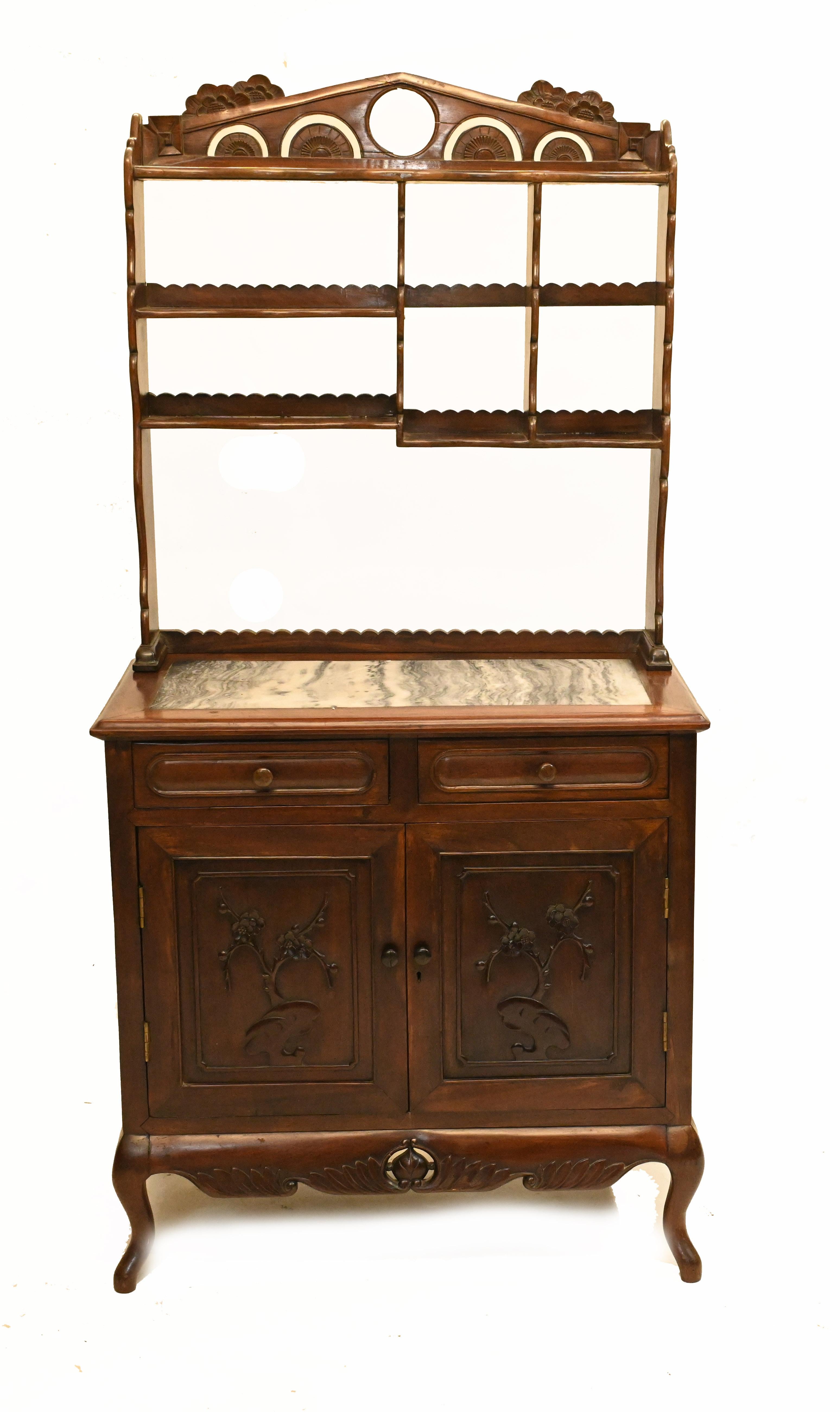 Stunning antique Chinese dresser in hardwood
Great for the kitchen with the marble top and shelving behind for storage
We date this to circa 1850
Nice Chinese trees in carved relief work on the two doors
Offered in great shape ready for home use