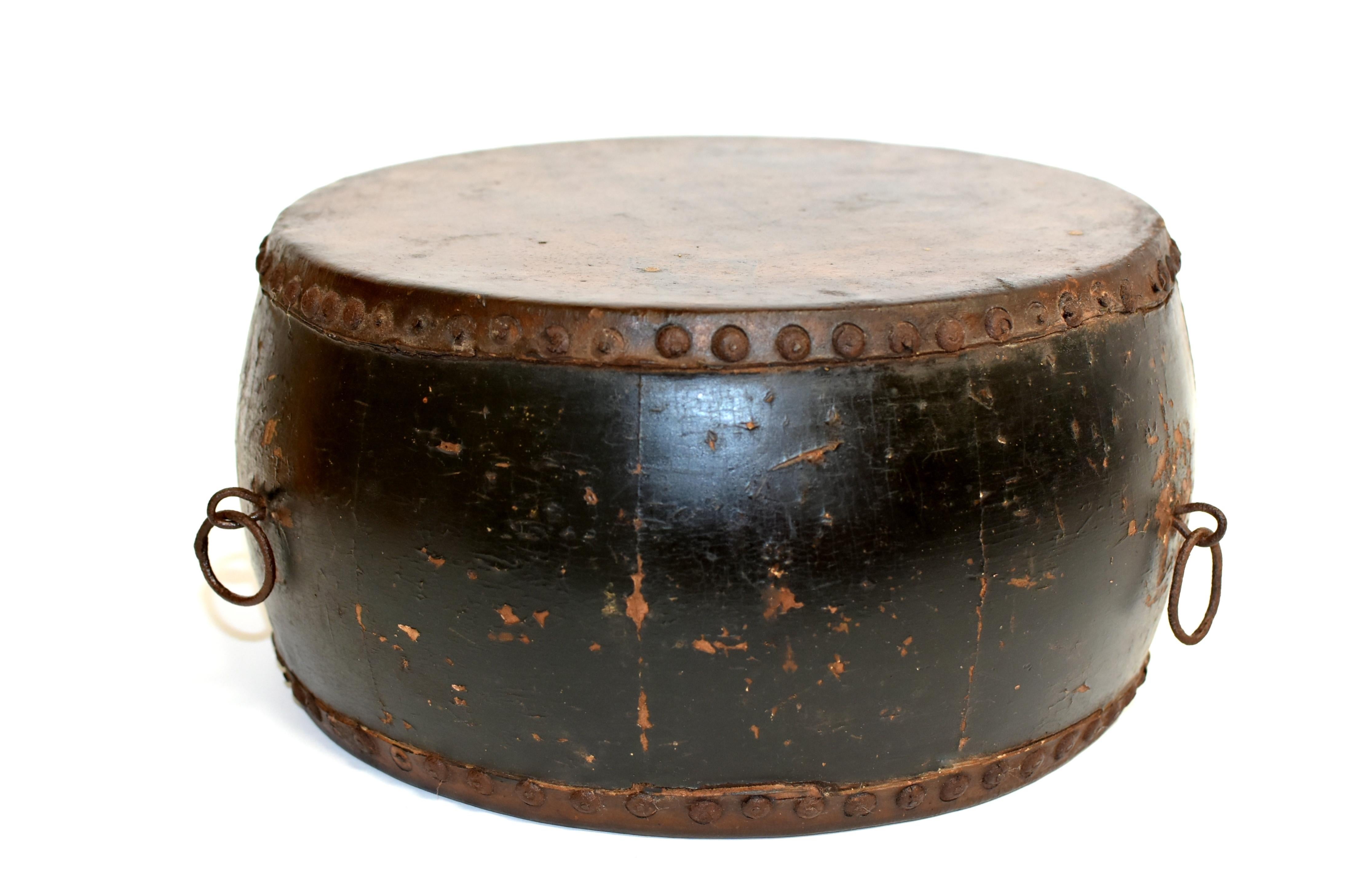 A beautiful old drum with stamps of Wealth God on both sides and maker's mark dating back to later 19th century. All original leather, iron nails and rings. This drum is the perfect size to be used on a table or a bookshelf. Great as a drum, as a