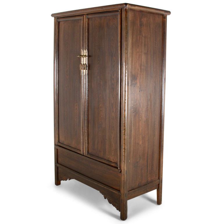 A dark-stained and finished, Chinese two-door cabinet in elm, the sides having an elegant upward taper, the two doors opening to reveal shelves. Nicely finished inside with brass fittings, circa 1910.



 
