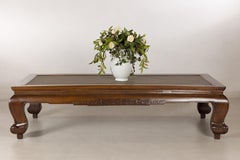 Antique Chinese Elm Opium Bed Coffee Table with Woven Rattan Top and Scroll Legs