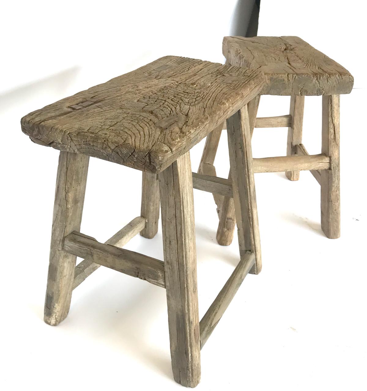 19th century Chinese elm stools with beautiful rustic patina.
Only the stool on the right is available. 15.5 x 9.5 x 19.5 H.
