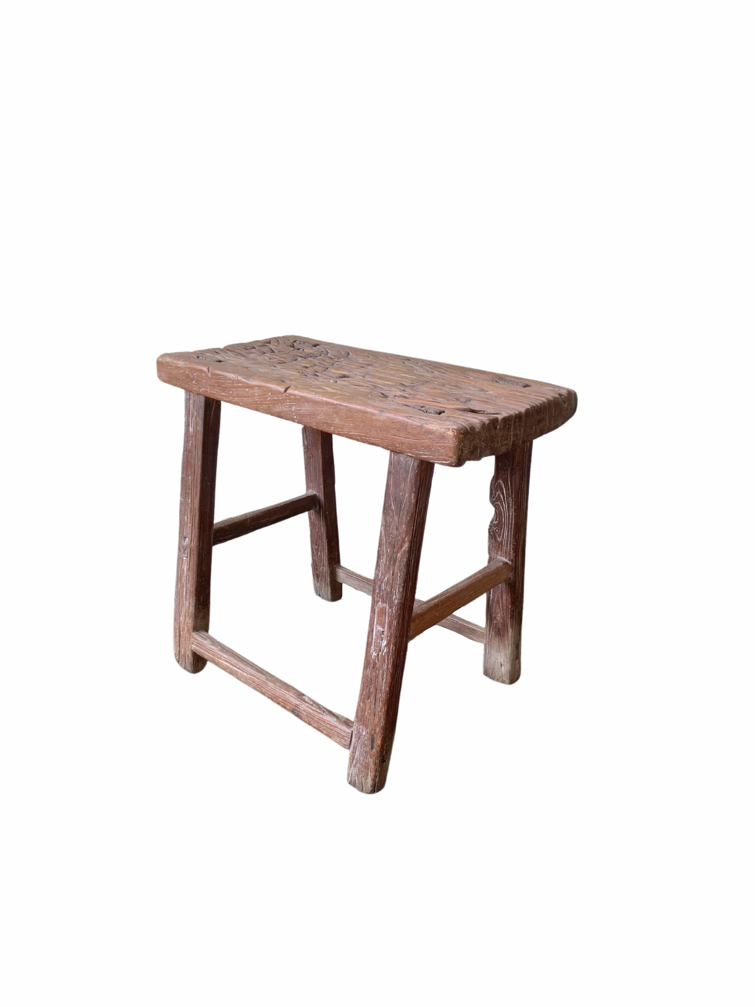 This antique elm wood stool comes from China's Hubei province. It was crafted using only wooden joints. The elm wood has aged beautifully over its more than 100 years of life. 


 
