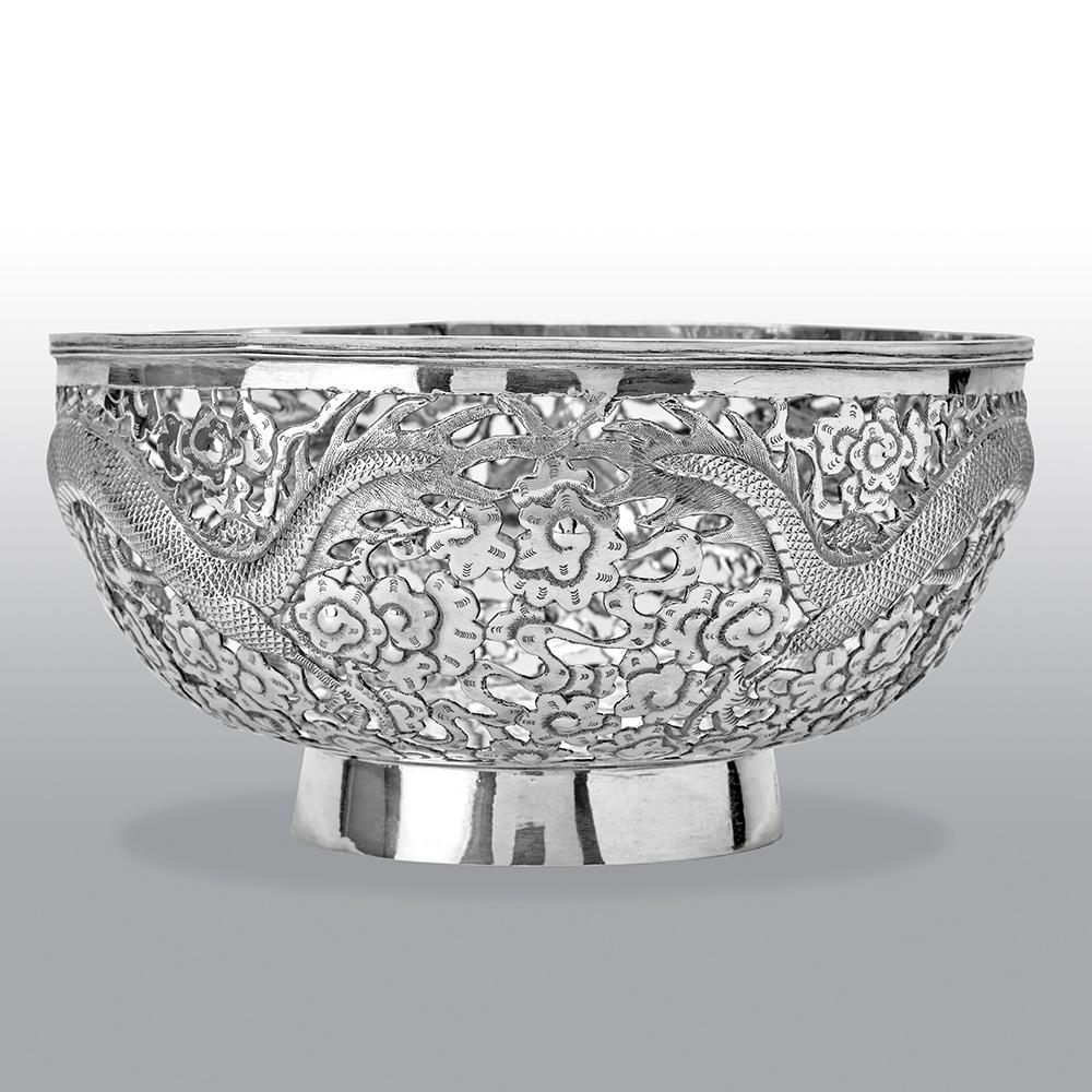 This fine antique Chinese export bowl, pierced and chased with oriental dragons and cloud designs.

Makers mark unknown. Later hallmarked with French import marks (swan),

circa 1880.

Weight: 340.1g.