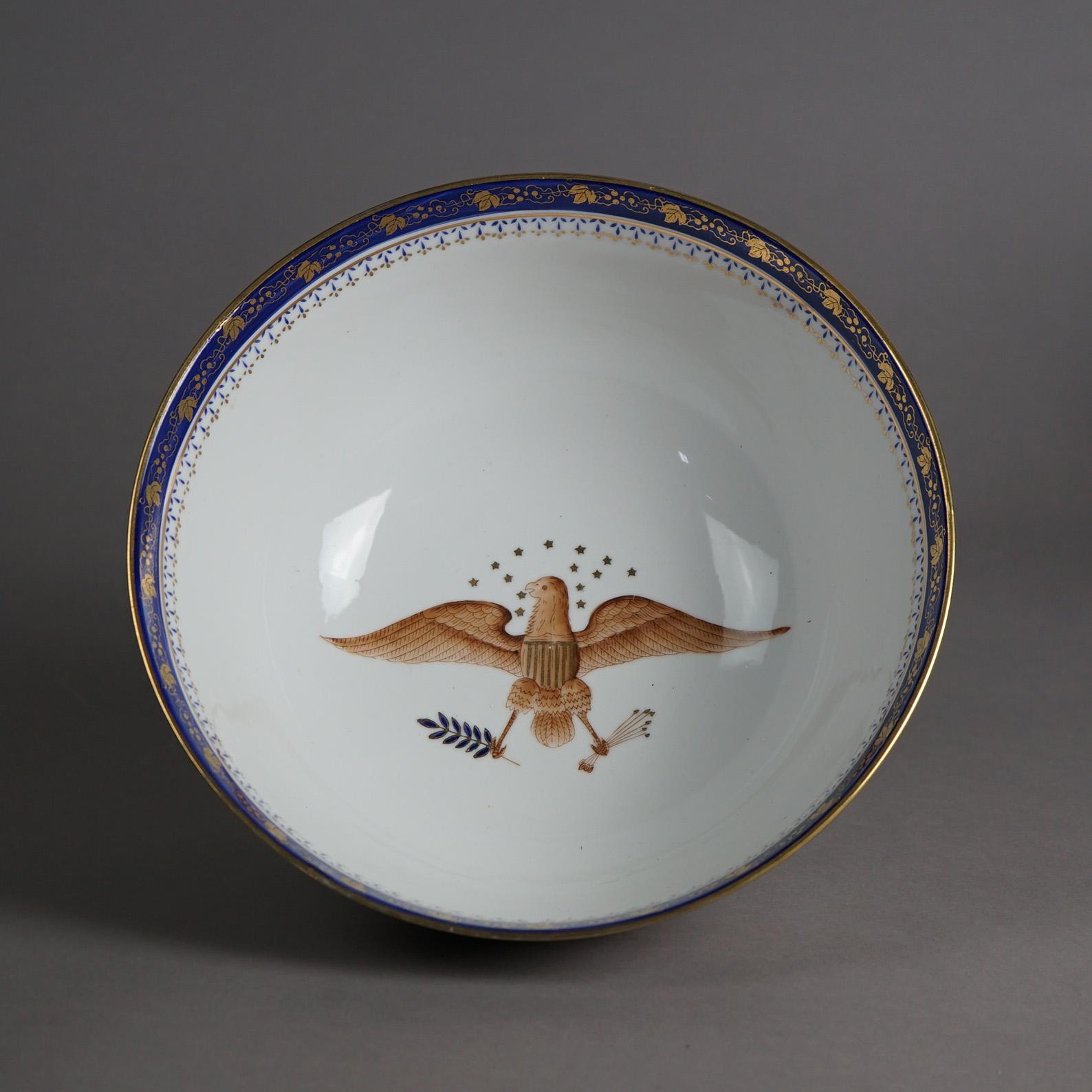 An antique Chinese Export bowl as displayed in the Diplomatic Reception Rooms, U.S. Department of State, Washington, D.C. offers porcelain construction with hand painted armorial American Eagle eagle (left claw with an olive branch representing