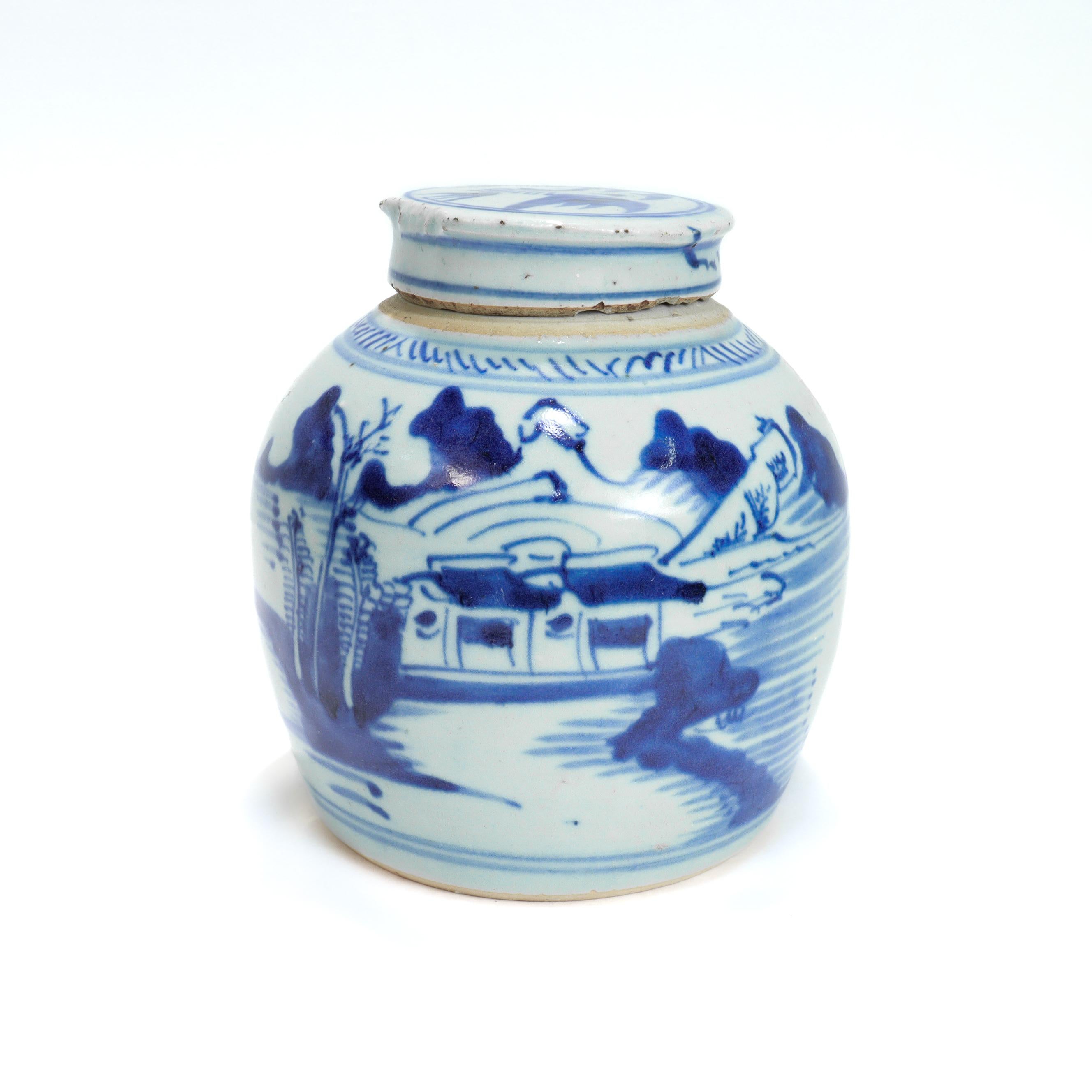 A fine antique Chinese export ginger jar. 

In the Canton pattern.

Decorated in underglaze blue with a mountainous Chinese village with houses, mountains, foliage, and a river and boat. 

Together with a conforming lid.

Having an unglazed rim and