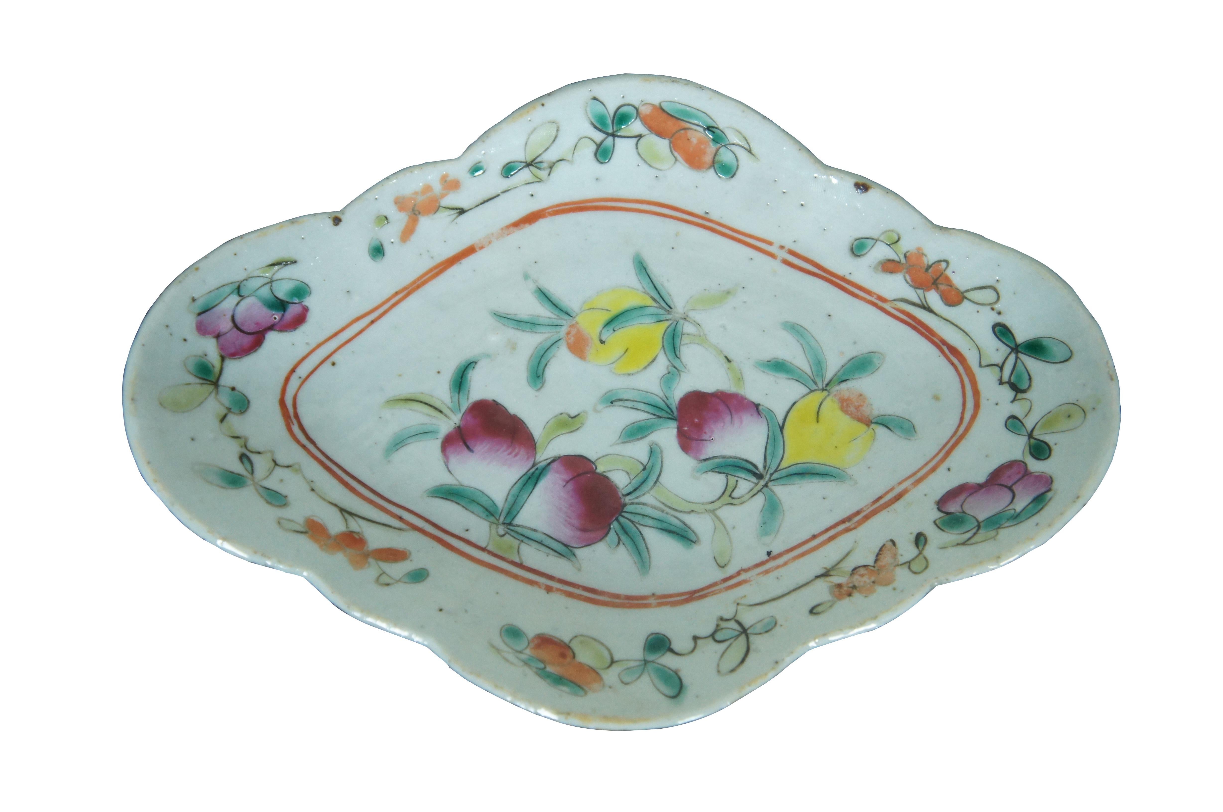 Antique early 20th century Chinese famille rose porcelain tazza / chop suey / footed altar dish with a scalloped oval edge, decorated with pink, orange and yellow flowers.

Dimensions:
9