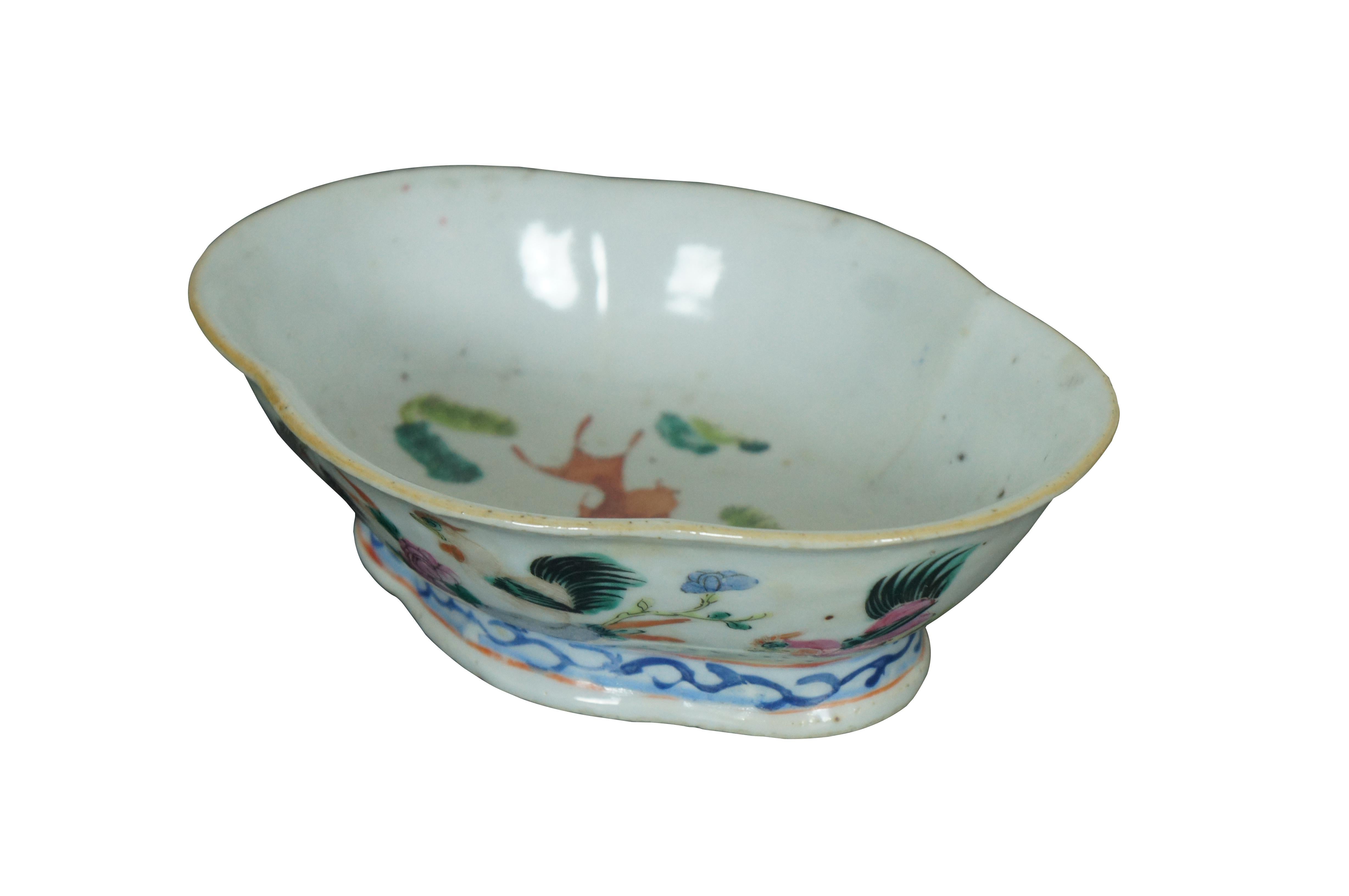An impressive mid 19th century Chinese Export Bowl.  Made from porcelain with polychrome rooster and hen design.  Features a lobed / scalloped shape with footed base.  The interior is features a koi fish design.  Great for serving or display. 