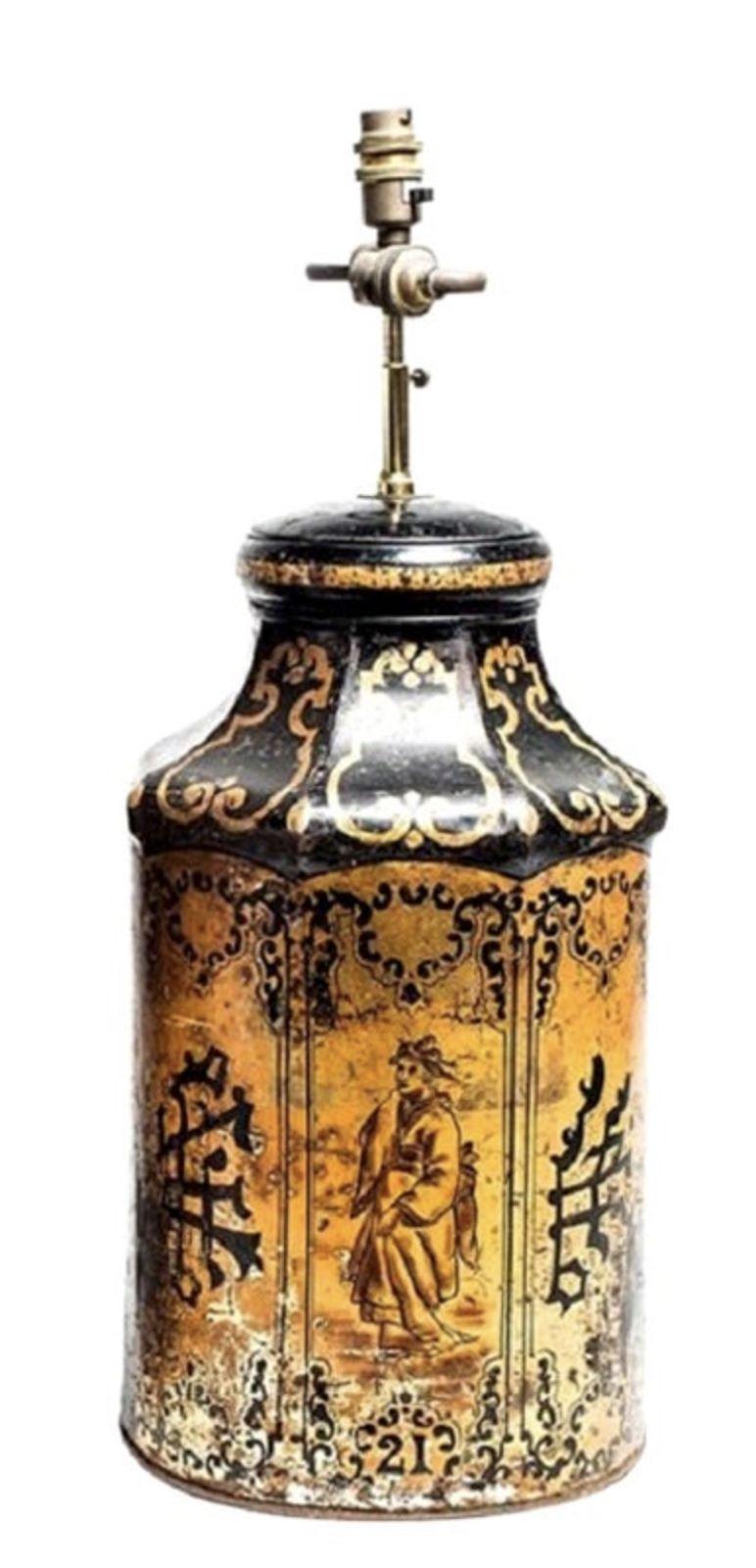 Unique table lamp made from repurposed Chinese Export tea tins, made in China circa 1870. This ornate, gilded tin was once used to transport tea from China to England. This jar is hand-painted with a fascinating combination of Western and Asian