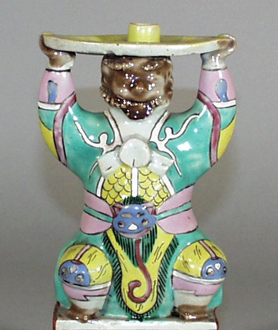 Chinese Export Incense Holder in form of a Mythical Male Figure,
Circa 1810-35.

The Chinese Export famille rose porcelain incense-holder is in the form of a male figure depicting a Northern male standing on a rectangular base.

He wears ornate