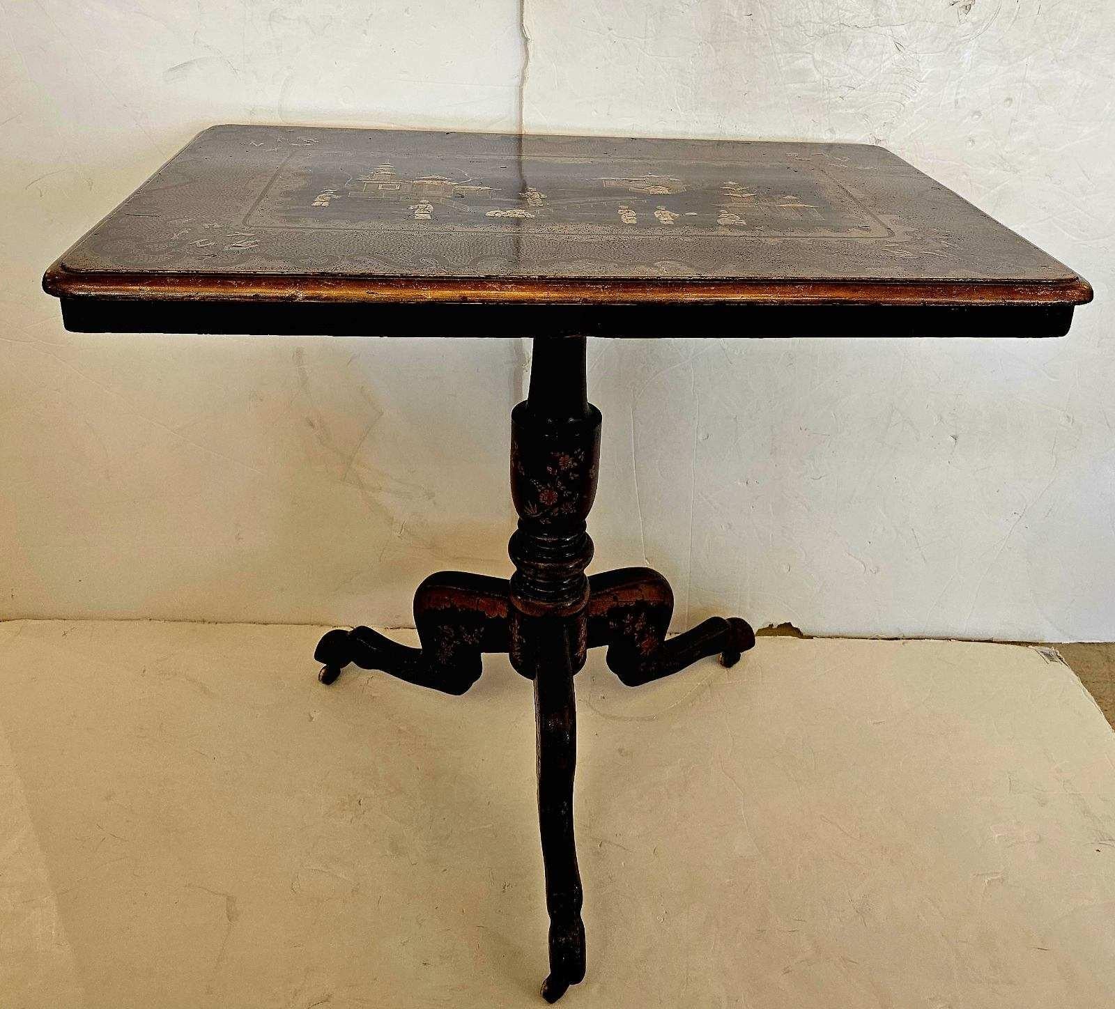 Mid 19th century beautiful Chinese Export chinoiserie tilt top table. Tripod base on original castors. Meticulously detailed decoration with pagoda and figures.
