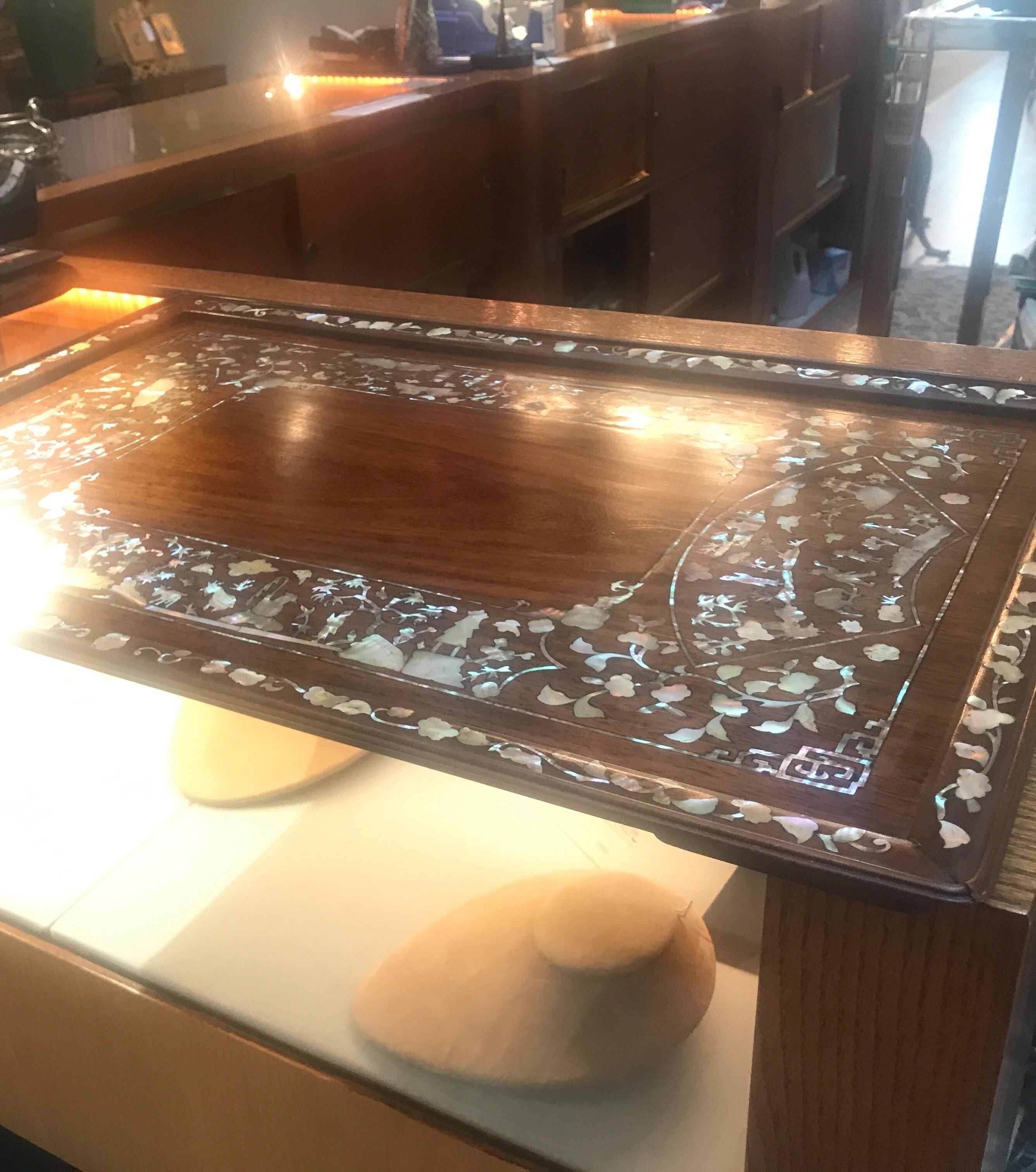 Exceptional antique Chines Export rosewood tray with hand inlaid mother of pearl. The square tray with intricate inlay all around the border, with raised inlaid edge. Well cared for condition with a recent French polish to clean any mars and scuff.