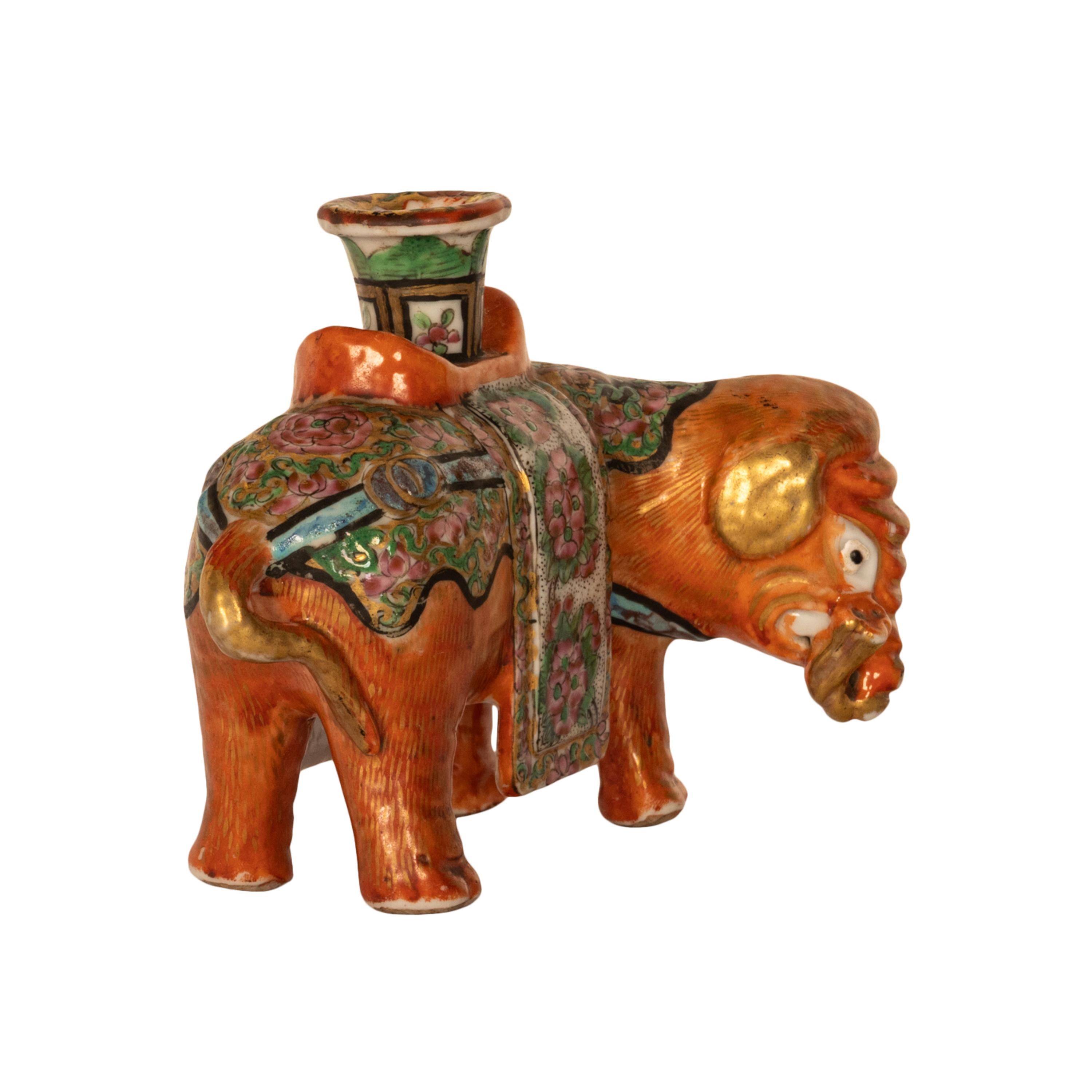 A  good antique Chinese Qing dynasty famille rose porcelain candleholder, circa 1860.
This very attractive antique Chinese porcelain elephant is hand-painted in the Canton famille rose palette, and profusely gilded throughout. The elephant having a