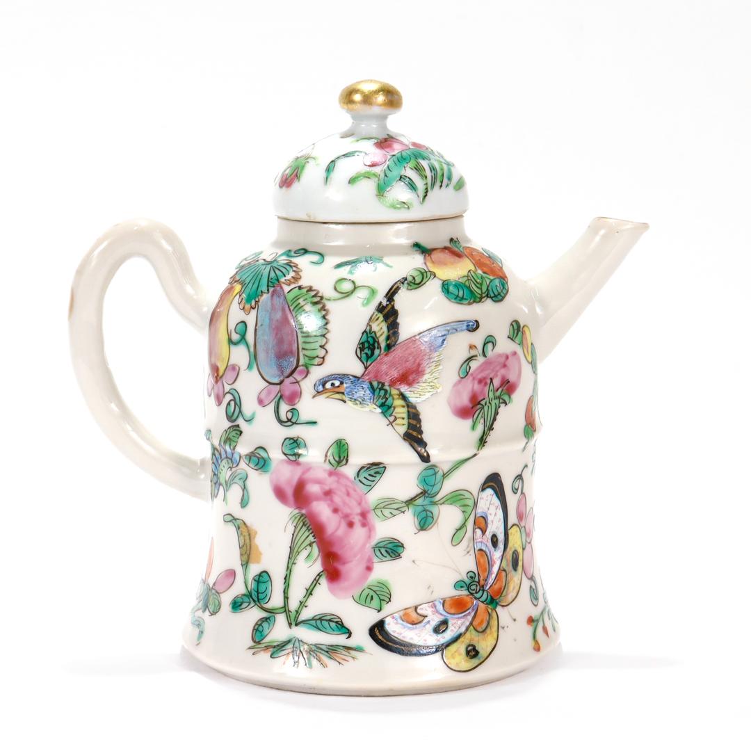 A fine antique Chinese Export porcelain teapot

In a Famille Rose pattern.

Decorated throughout with birds, butterflies, flowers, and fruit.
.
Simply a wonderful miniature Chinese porcelain teapot!

Date:
20th Century or earlier

Overall