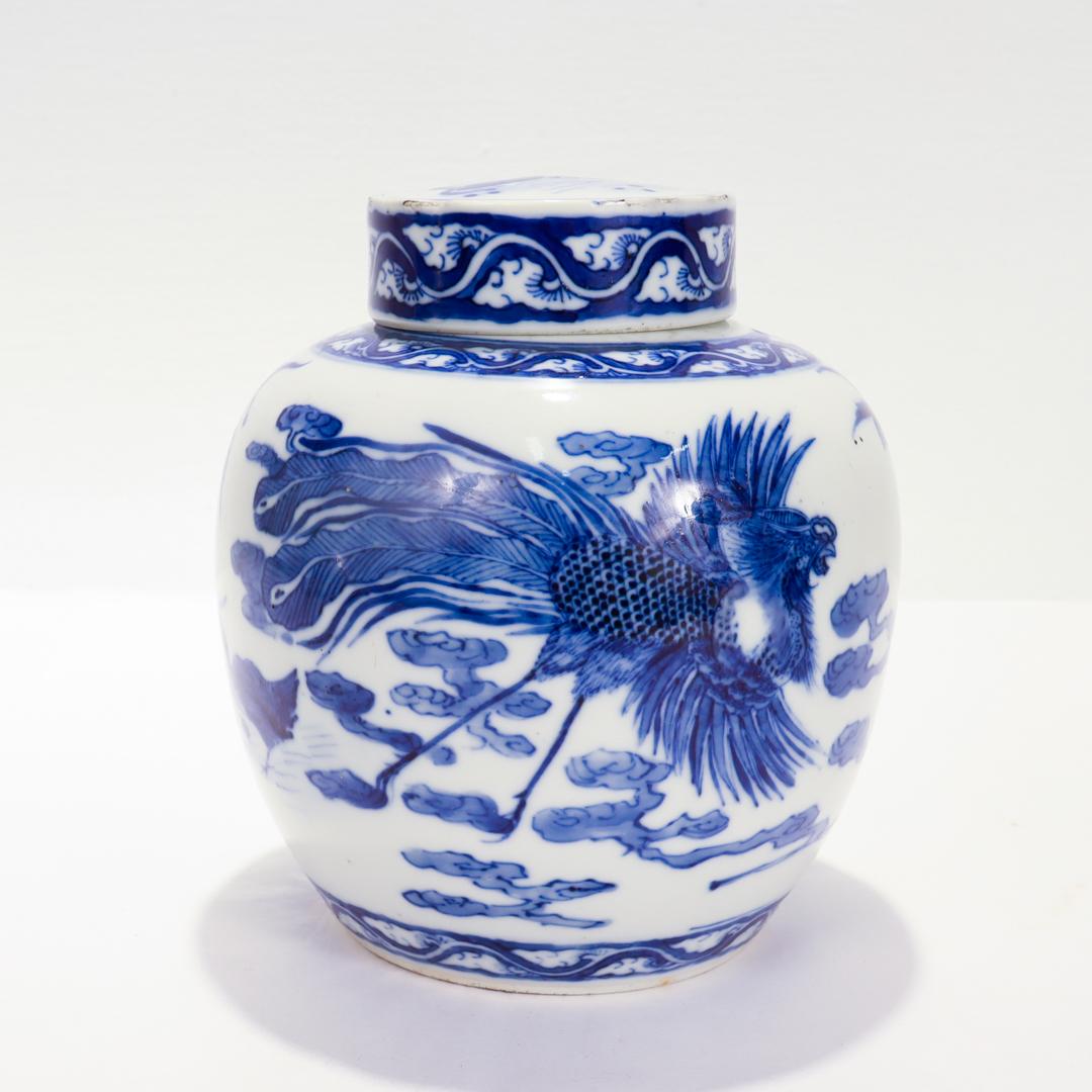 A fine antique Chinese export porcelain ginger jar.

With a white ground and blue decoration.

With a depiction of a Chinese phoenix (Fènghuáng, 鳳凰) amongst the clouds, along with depictions of peacocks, mandarin ducks, and swallows around the