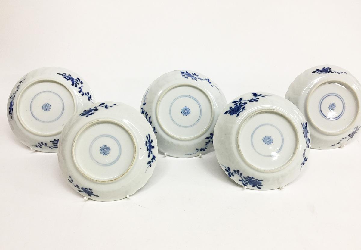 Antique Chinese export porcelain plates

Antique Chinese export plates dates from the Reign of the Chinese Emporer of period Kangxi 1662-1722 with scene of a flower garden on rocks and birds and flowers in panels

Marked with the flower on the