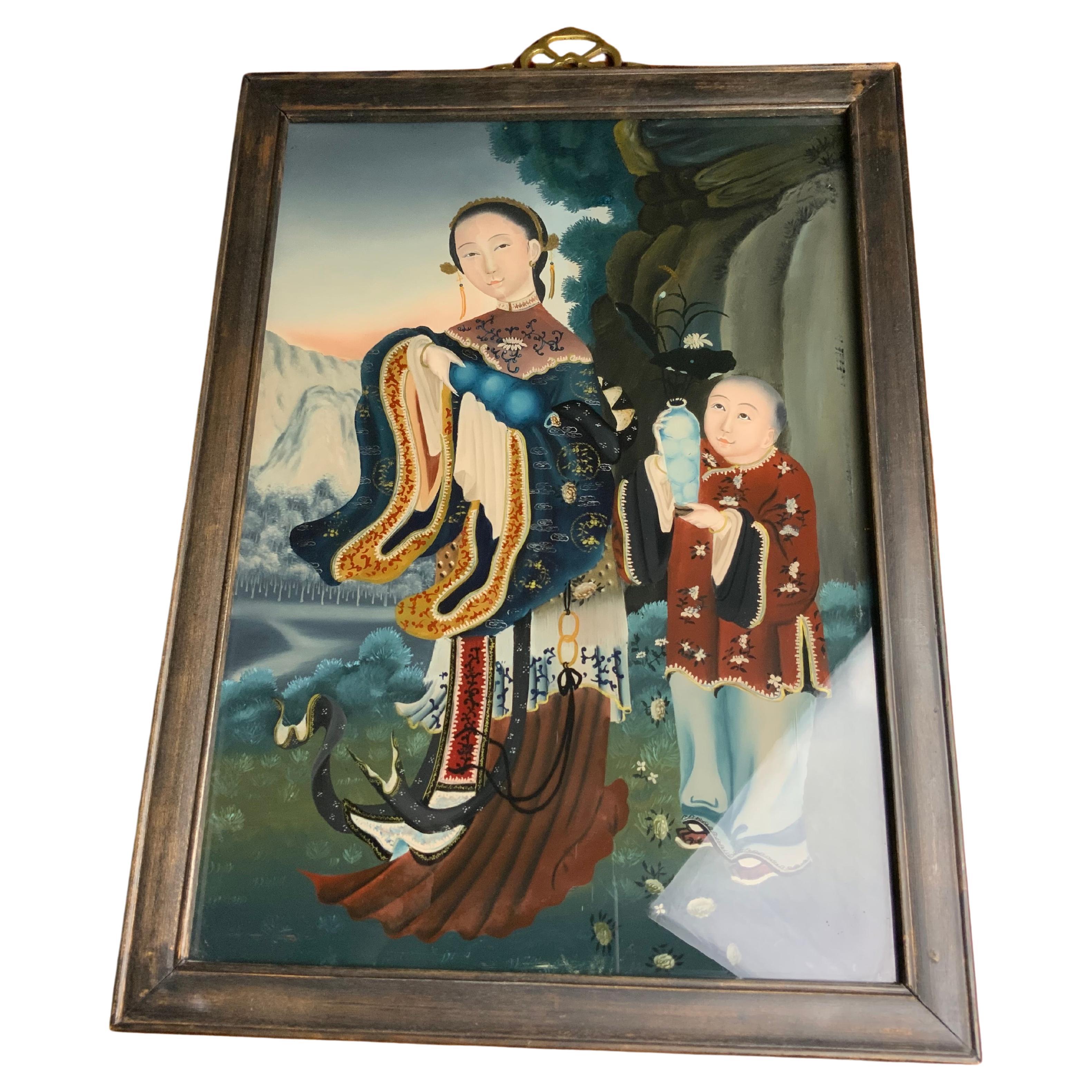 A very nice late 19th century to early 20th century, Chinese export reverse glass painting, depicting a noblewoman within a courtyard setting with a kid who is holding a lotus in a vase in a garden setting. The painting comes with its original