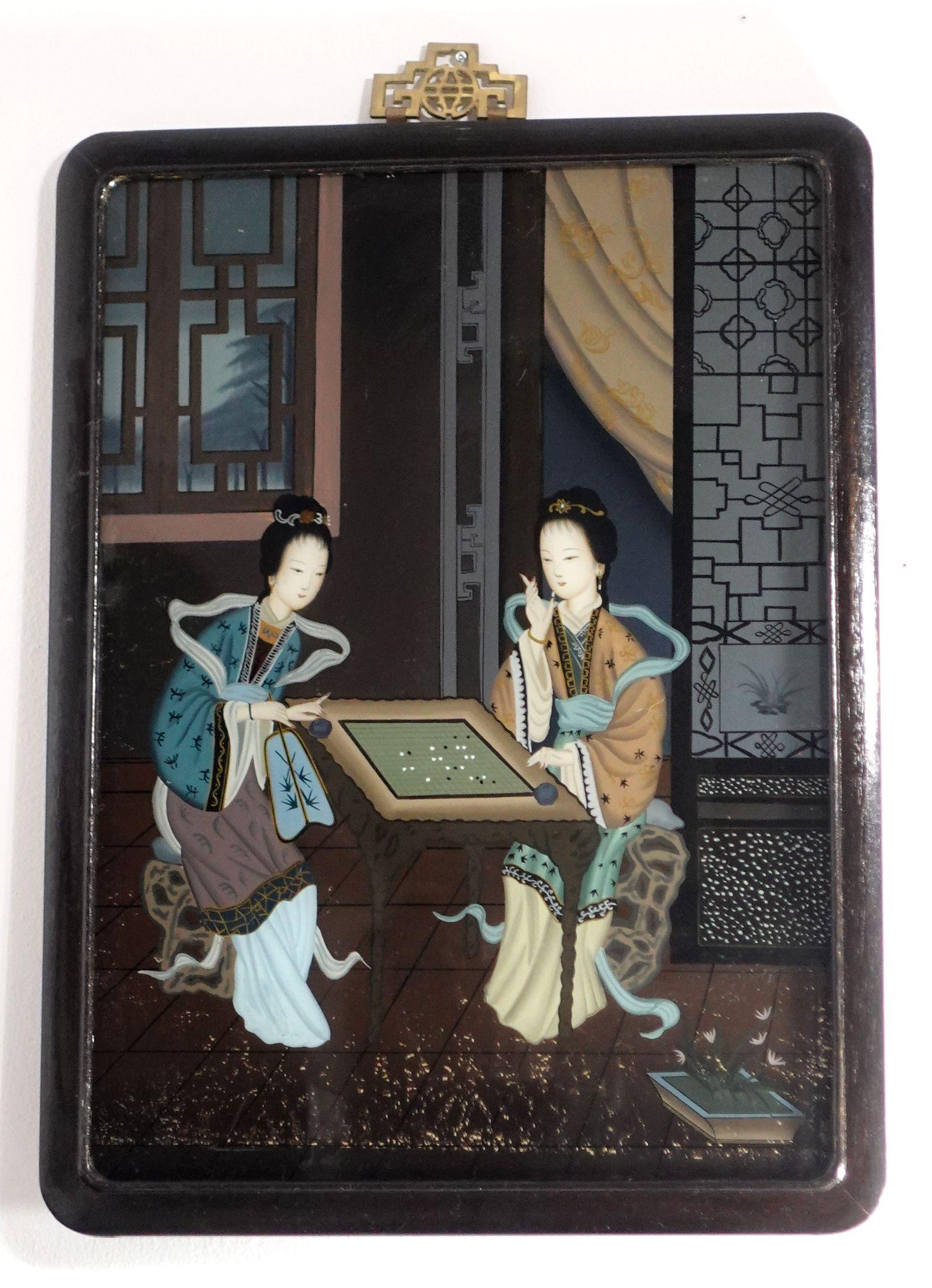 A charming late 19th-century to early 20th-century, Chinese export reverse glass painting, depicting two noblewomen within an interior setting playing Chinese chess. The painting comes with its original hardwood frame and the old pins in the back of