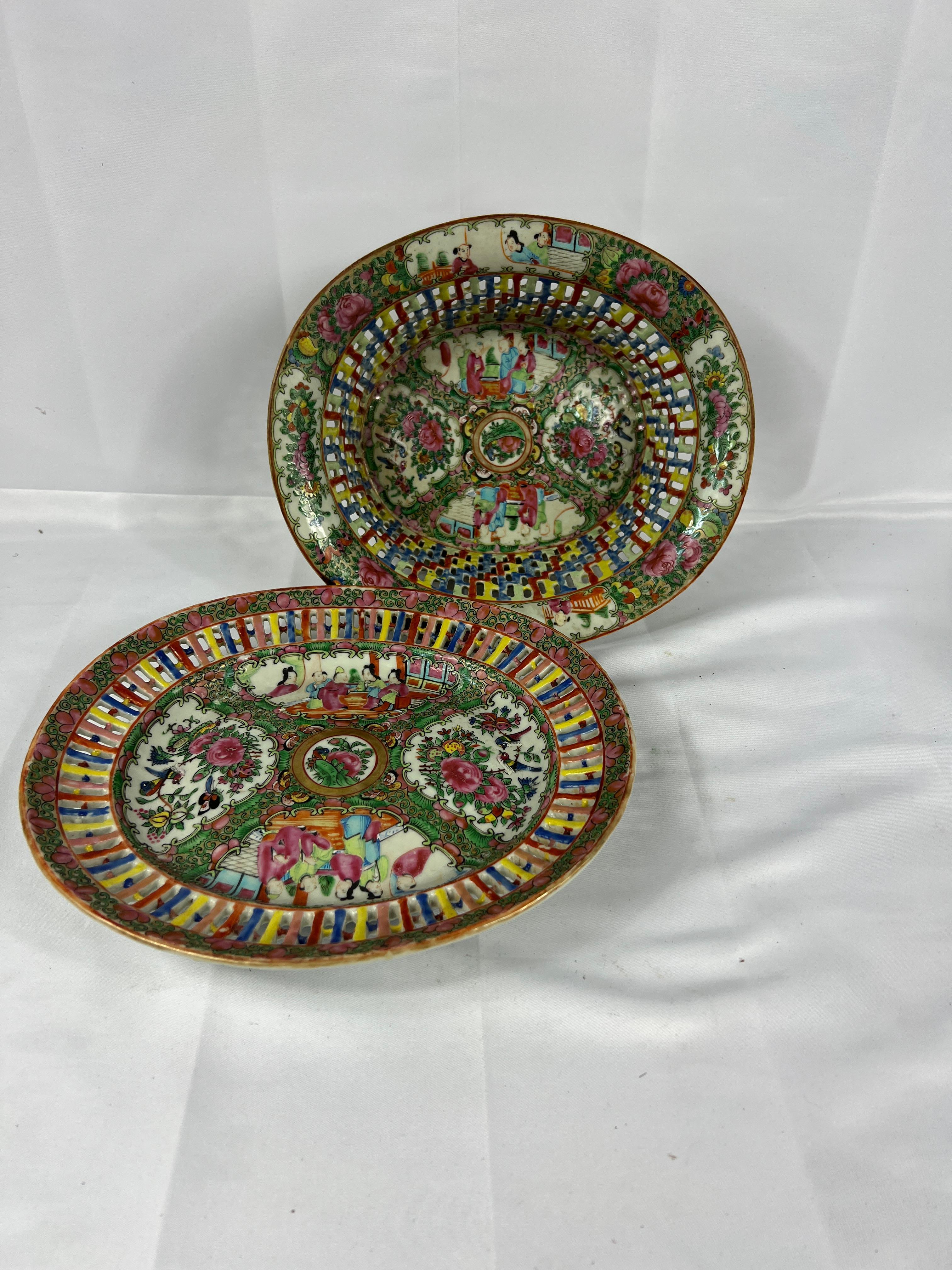 This exquisite 19th-century Chinese Export Rose Medallion fruit basket and undertray exemplify the artistry and craftsmanship of traditional Chinese porcelain. The pierced fruit basket is a remarkable work of porcelain design, featuring delicately
