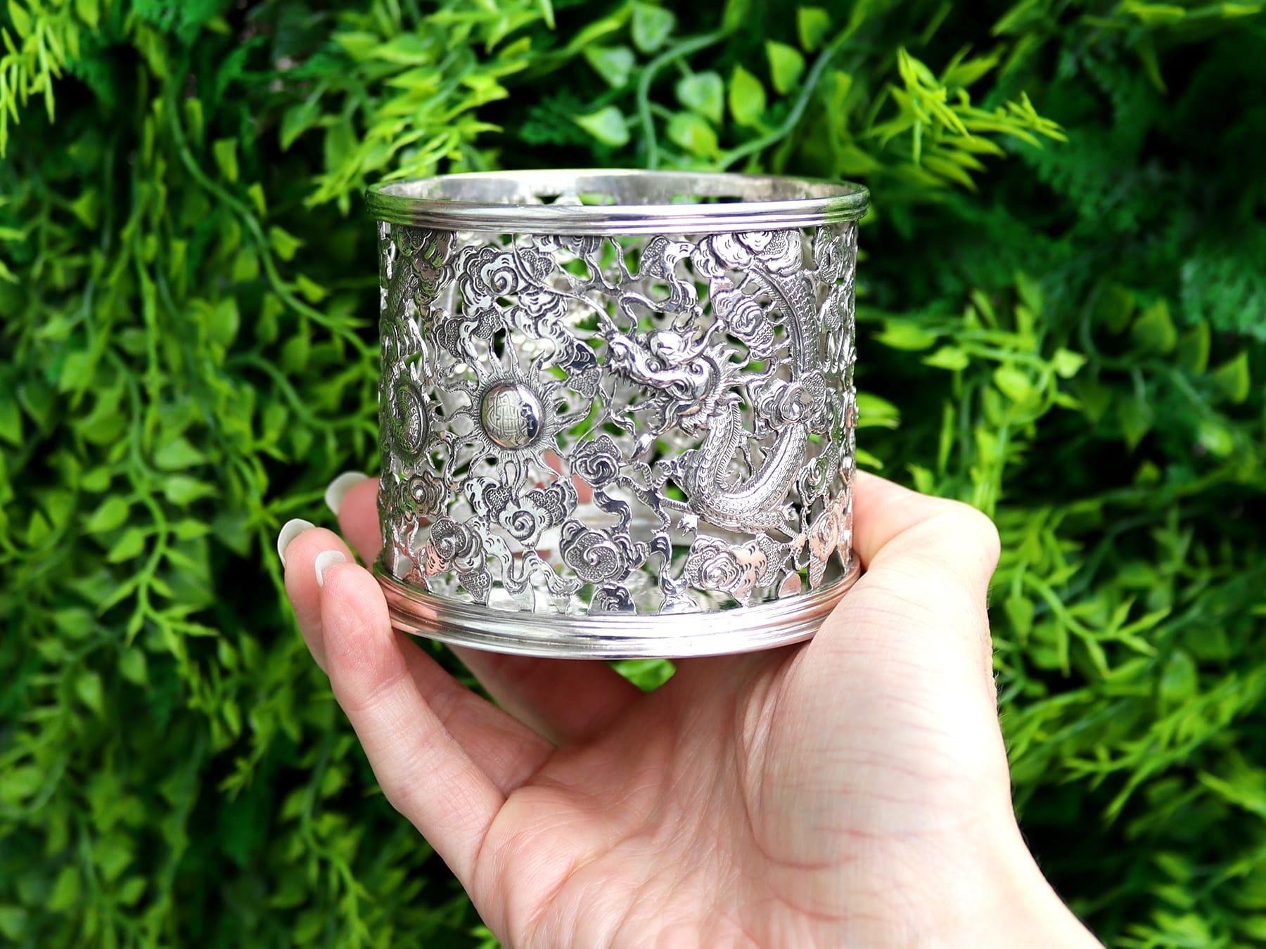 An exceptional, fine and impressive antique Chinese export silver bottle coaster, an addition to our ornamental silverware collection.

This exceptional antique Chinese Export Silver (CES) bottle coaster has a cylindrical form to a plain spreading