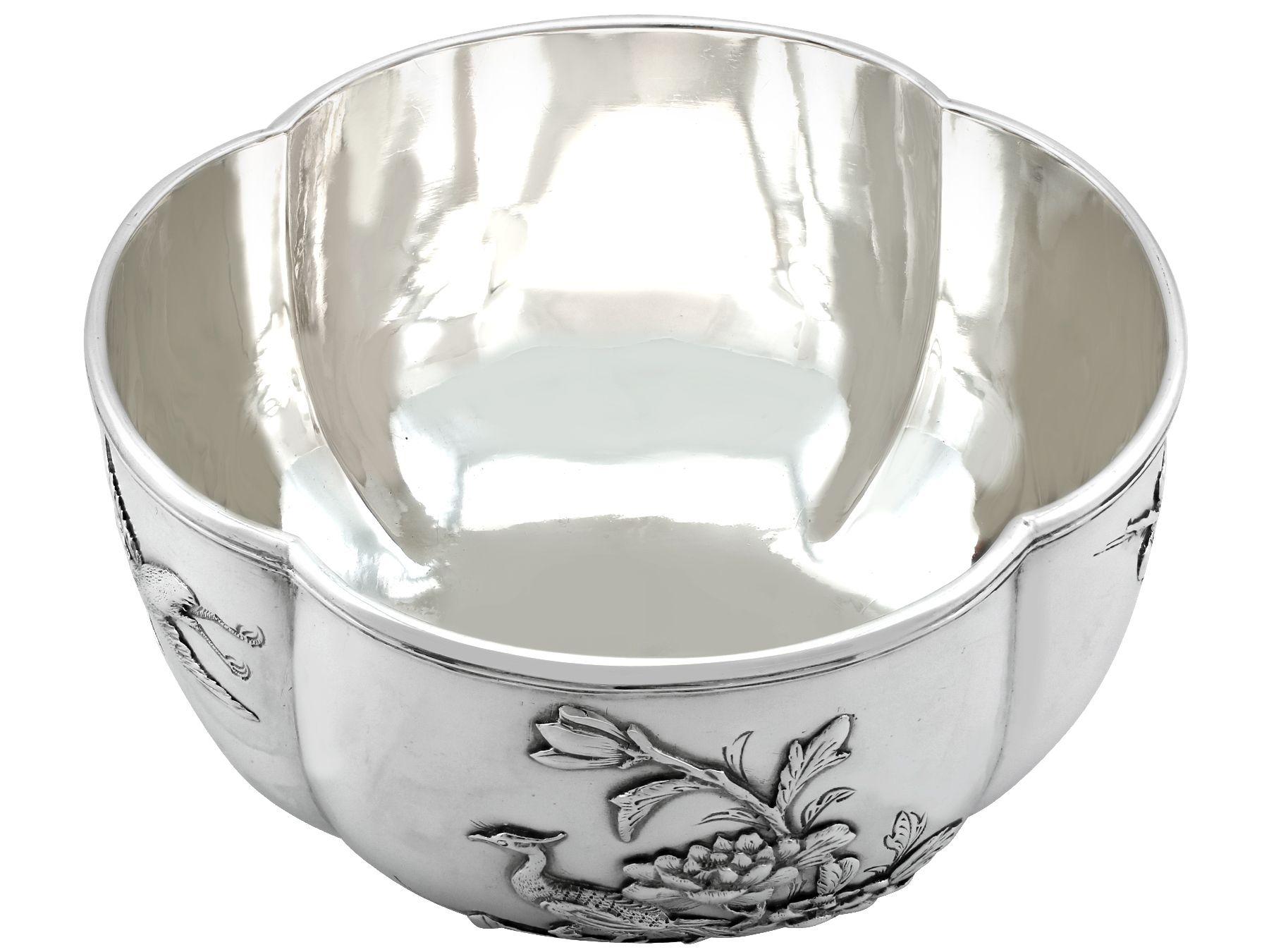An exceptional, fine and impressive antique Chinese export silver bowl; an addition to our Asian silverware collection.

This exceptional Chinese Export Silver bowl has a circular rounded form onto a plain collet foot.

The incurved panelled
