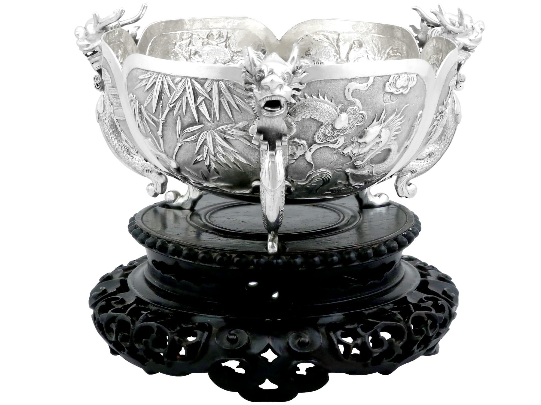 An exceptional, fine and impressive antique Chinese Export Silver bowl on stand featuring dragons; an addition to our Asian/Chinese silverware collection.

This impressive Chinese Export Silver (CES) bowl has a circular rounded form.

The body of