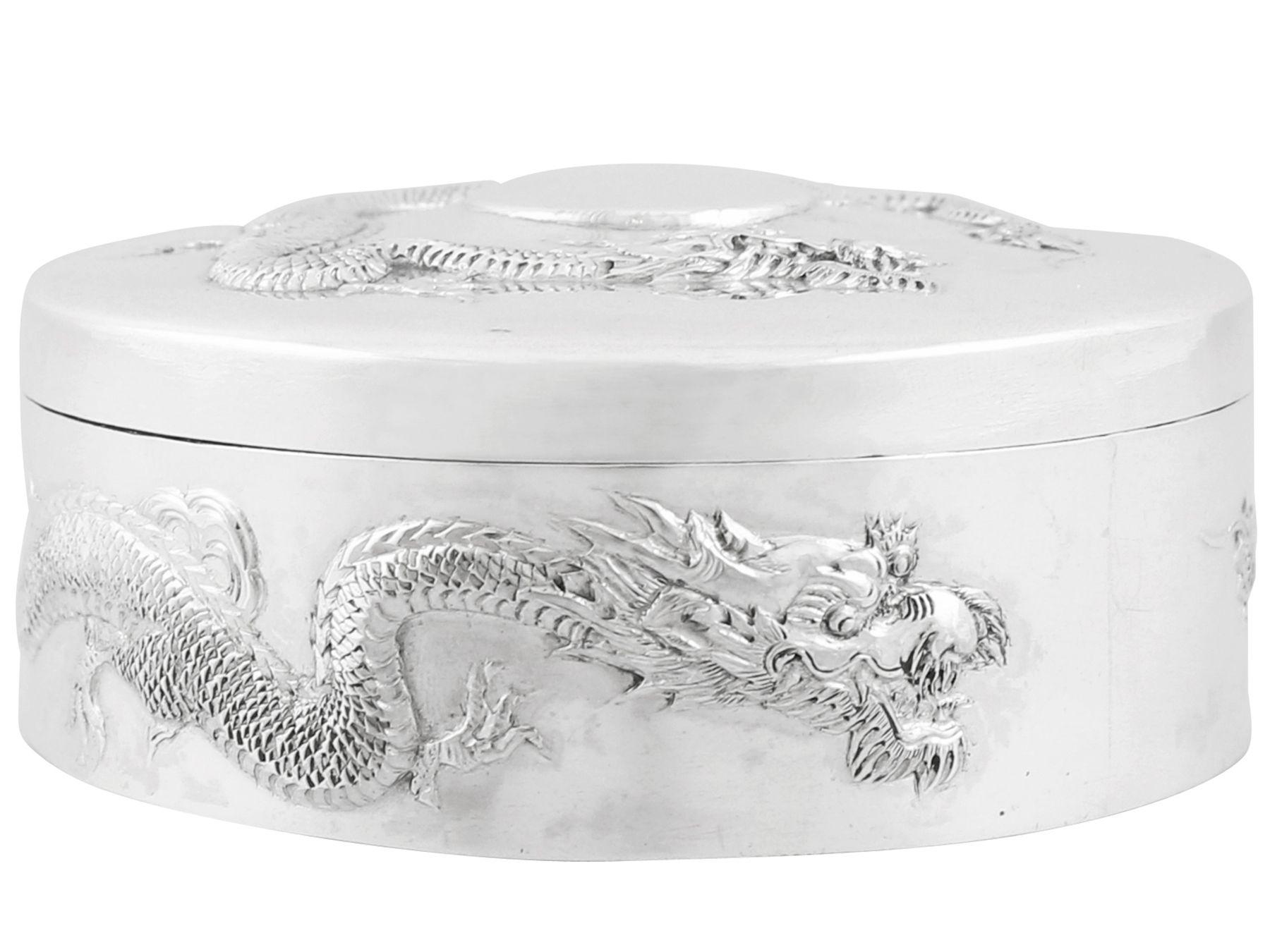 An exceptional, fine and impressive antique Chinese export silver dragon box; an addition to our collection of boxes and cases

This fine antique Chinese export silver (CES) box has a cylindrical form.

The surface of the body is embellished