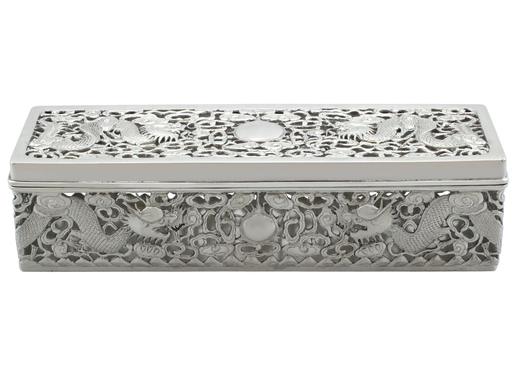 An exceptional, fine and impressive antique Chinese Export silver box; an addition to our collection of boxes and cases.

This exceptional antique Chinese Export Silver (CES) box has a rectangular form.

Each elongated side of the box is