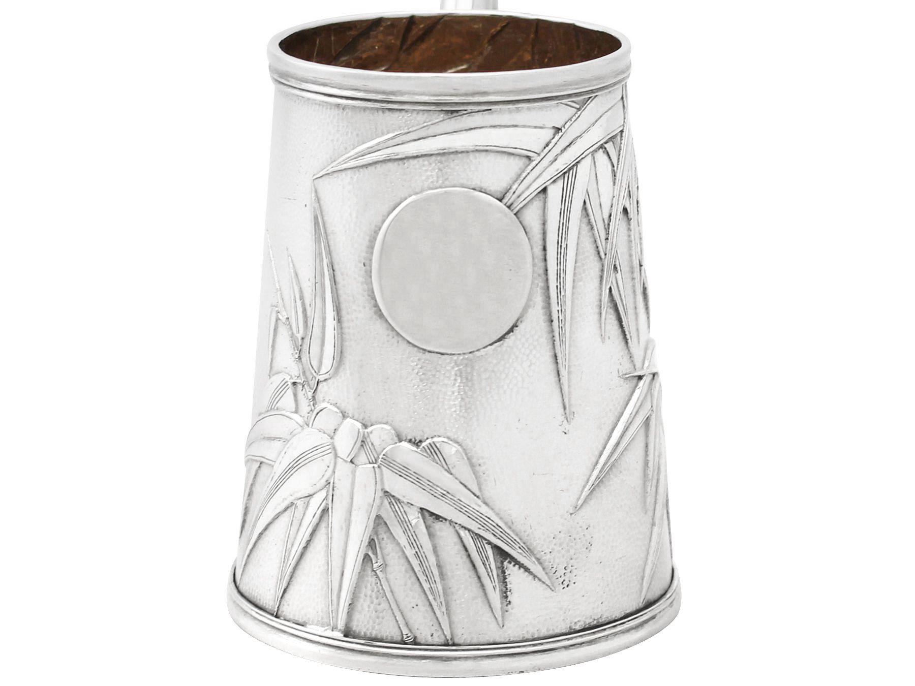 A fine antique Chinese Export silver christening mug, part of our silverware collection.

This fine Chinese Export silver christening mug has a tapering cylindrical form.

The christening mug is embellished with a planished surface and embossed