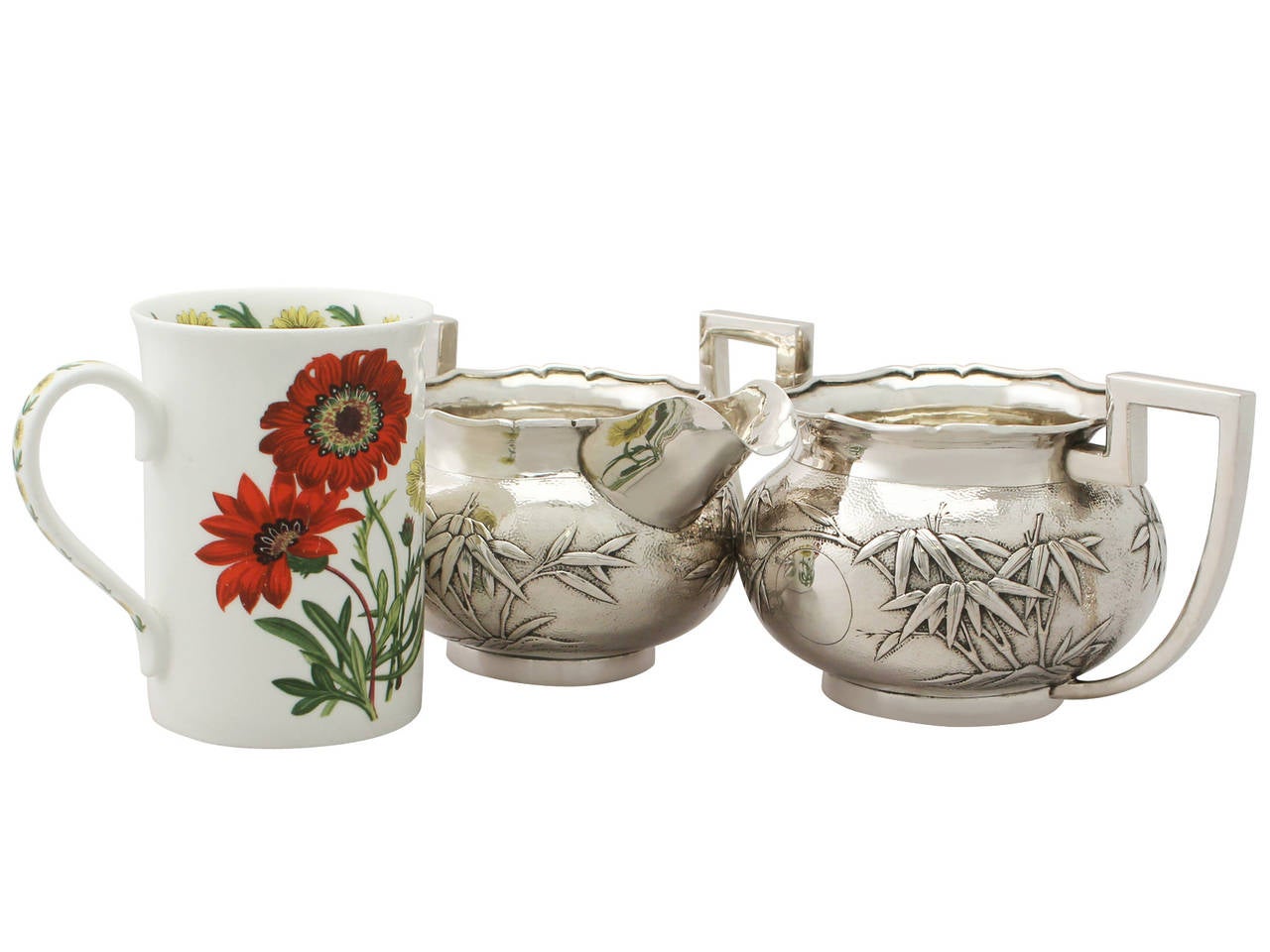 A fine Chinese Export silver creamer and sugar bowl; part of our Asian silverware collection.

This fine antique Chinese Export Silver (CES) cream jug and sugar bowl have an oval rounded form onto a collet foot.

This antique silver sugar bowl