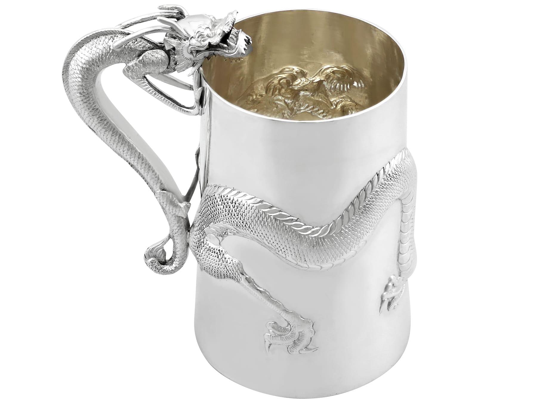 An exceptional, fine and impressive antique Chinese Export Silver mug with dragons; an addition to our oriental silverware collection.

This exceptional antique Chinese silver mug has a tapering cylindrical form.

The surface of the mug is