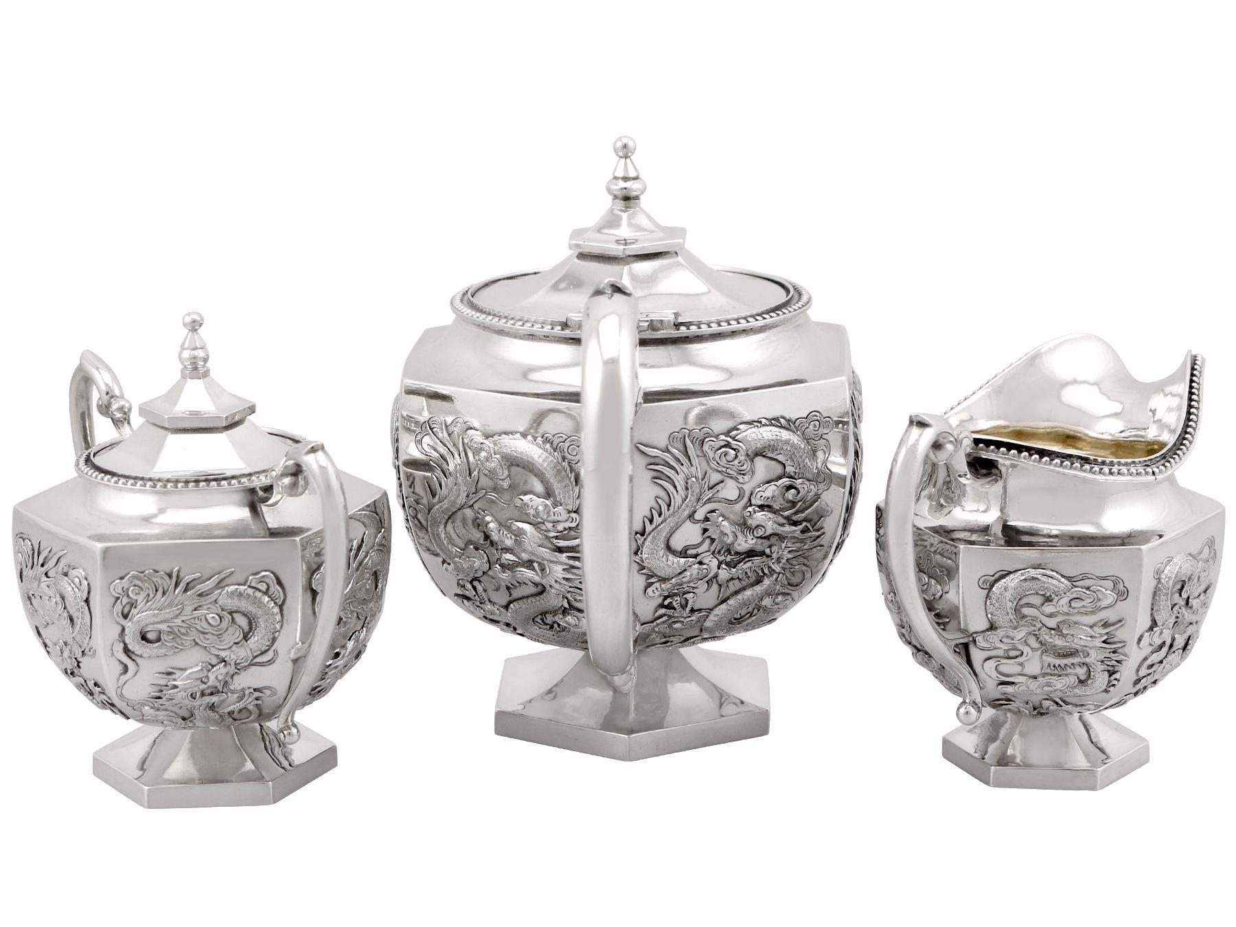 An exceptional, fine and impressive antique Chinese export silver three piece tea service; an addition to our diverse silver teaware collection.

This exceptional antique Chinese silver tea set/service consists of a teapot, cream jug and covered