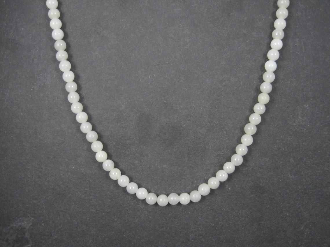 This gorgeous antique necklace is comprised of 7mm white mutton jade beads and a screw style clasp.

Measurements: 7mm wide, 25 wearable inches
Weight: 54.4 grams

Marks: Chinese hallmark

Condition: Excellent